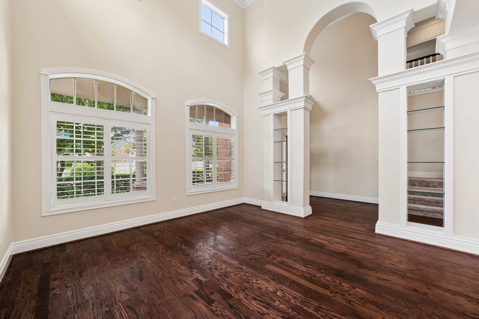 Stunning open-concept living area with rich hardwood floors.
