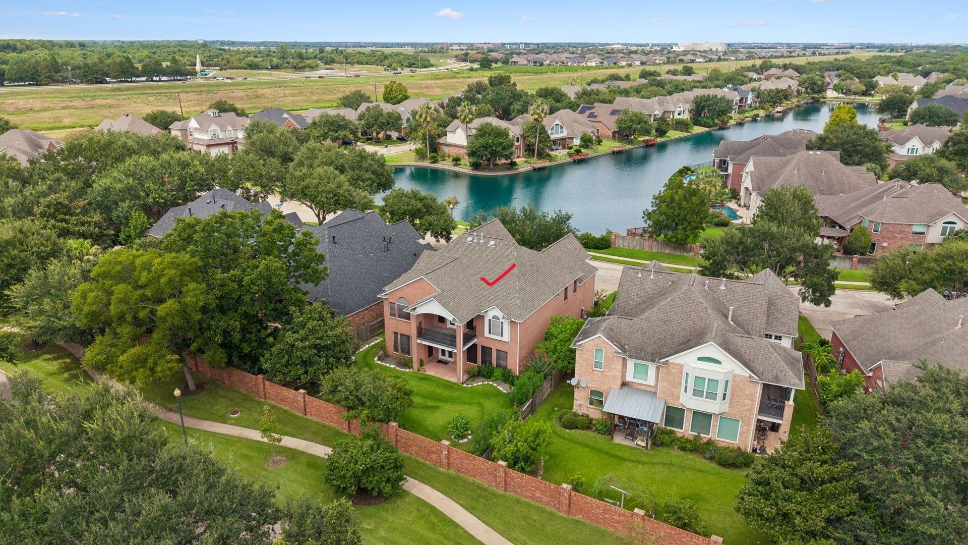 Nestled in a picturesque neighborhood, this home offers serene lake views and lush greenery, providing a peaceful and inviting atmosphere.