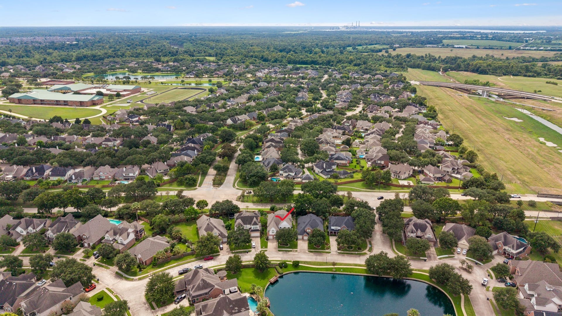 Charming two-story home nestled in a picturesque suburban neighborhood, featuring a spacious driveway and lush greenery. Ideal for families seeking a serene and friendly community.
