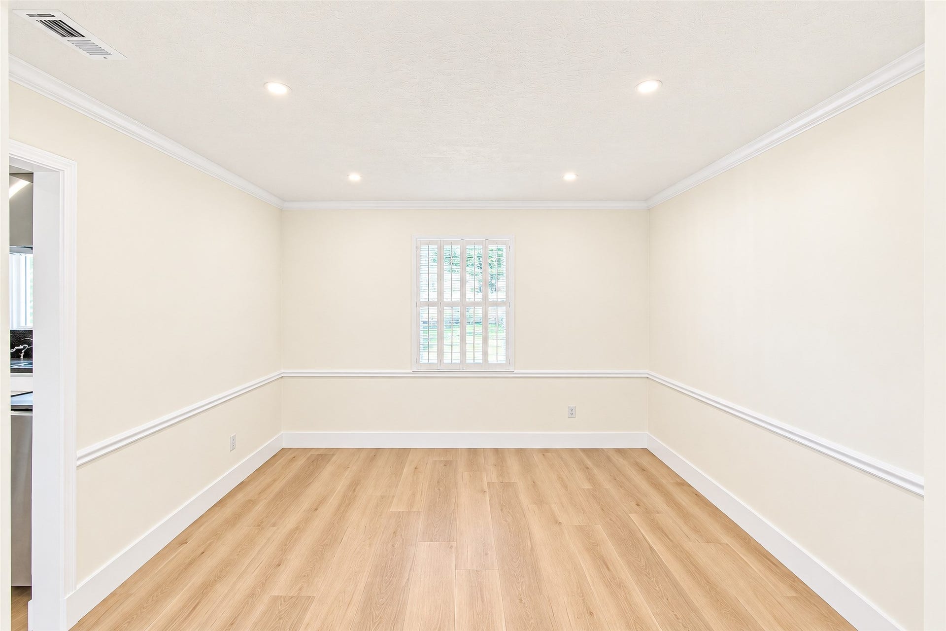10610 Overbrook Lane, Houston, TX 77042 Bright and inviting, this dining room features elegant vinyl flooring and soft natural light, creating the perfect setting for memorable gatherings.
