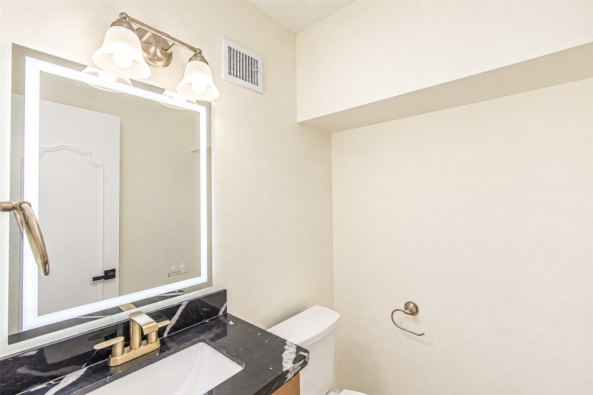 10610 Overbrook Lane, Houston, TX 77042 Elegant powder room featuring a sleek quartz marble countertop, modern fixtures, and ambient lighting for a sophisticated touch.