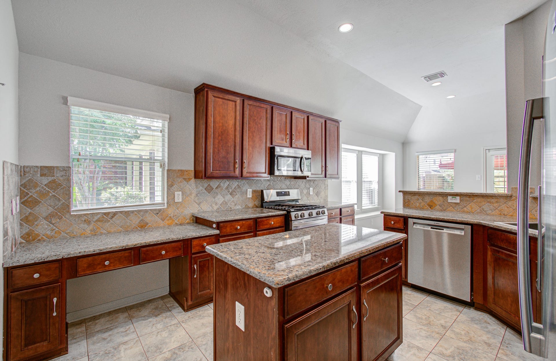 12808 Brook Arbor Court, Pearland, TX 77584 Another view of the kitchen showing the desk space in the kitchen.