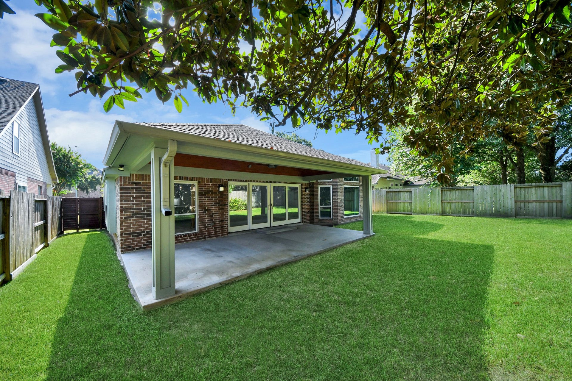 View of the back yard and the back of the home