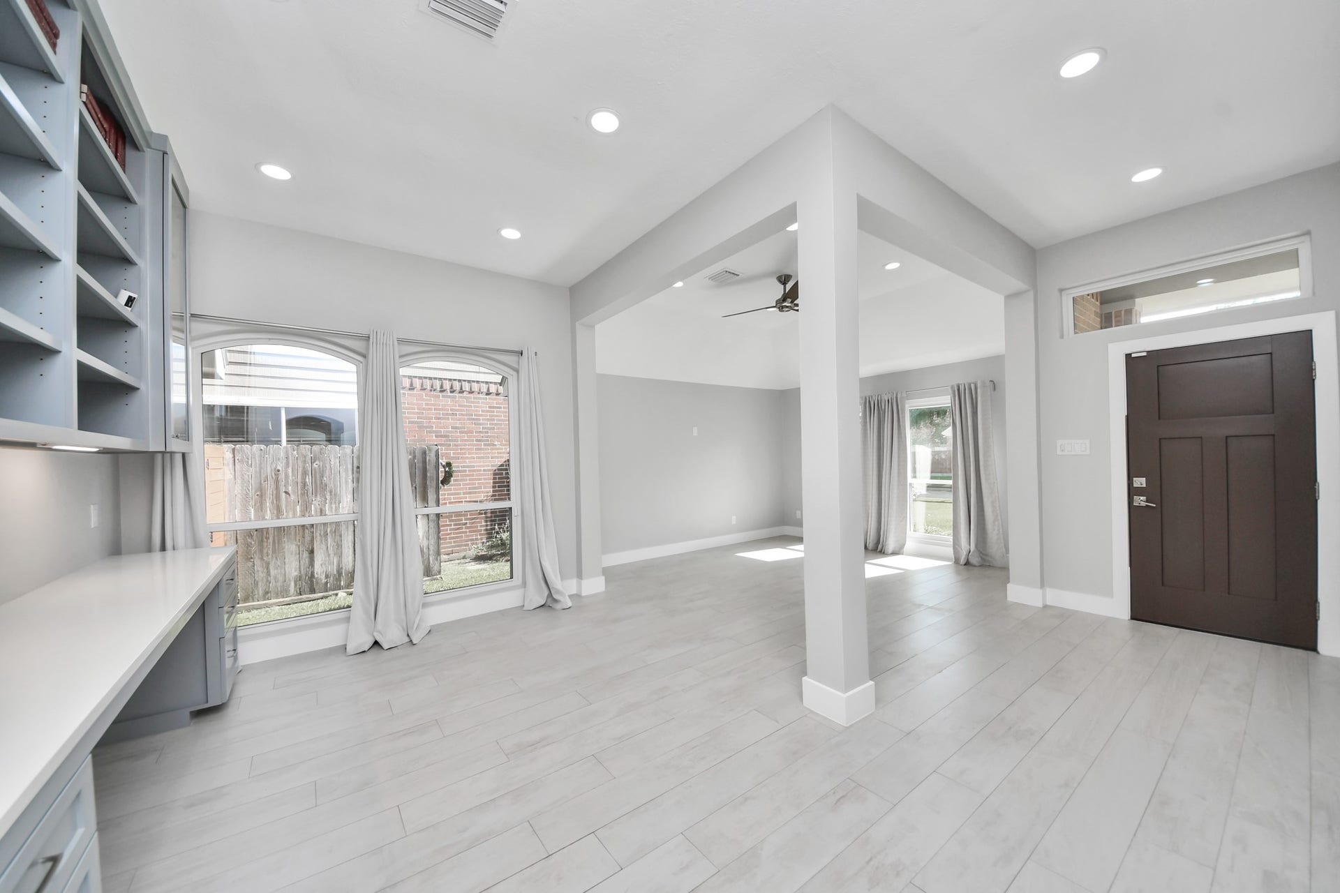 Formal living/seating area and built in library or study all made custom with solid wood.