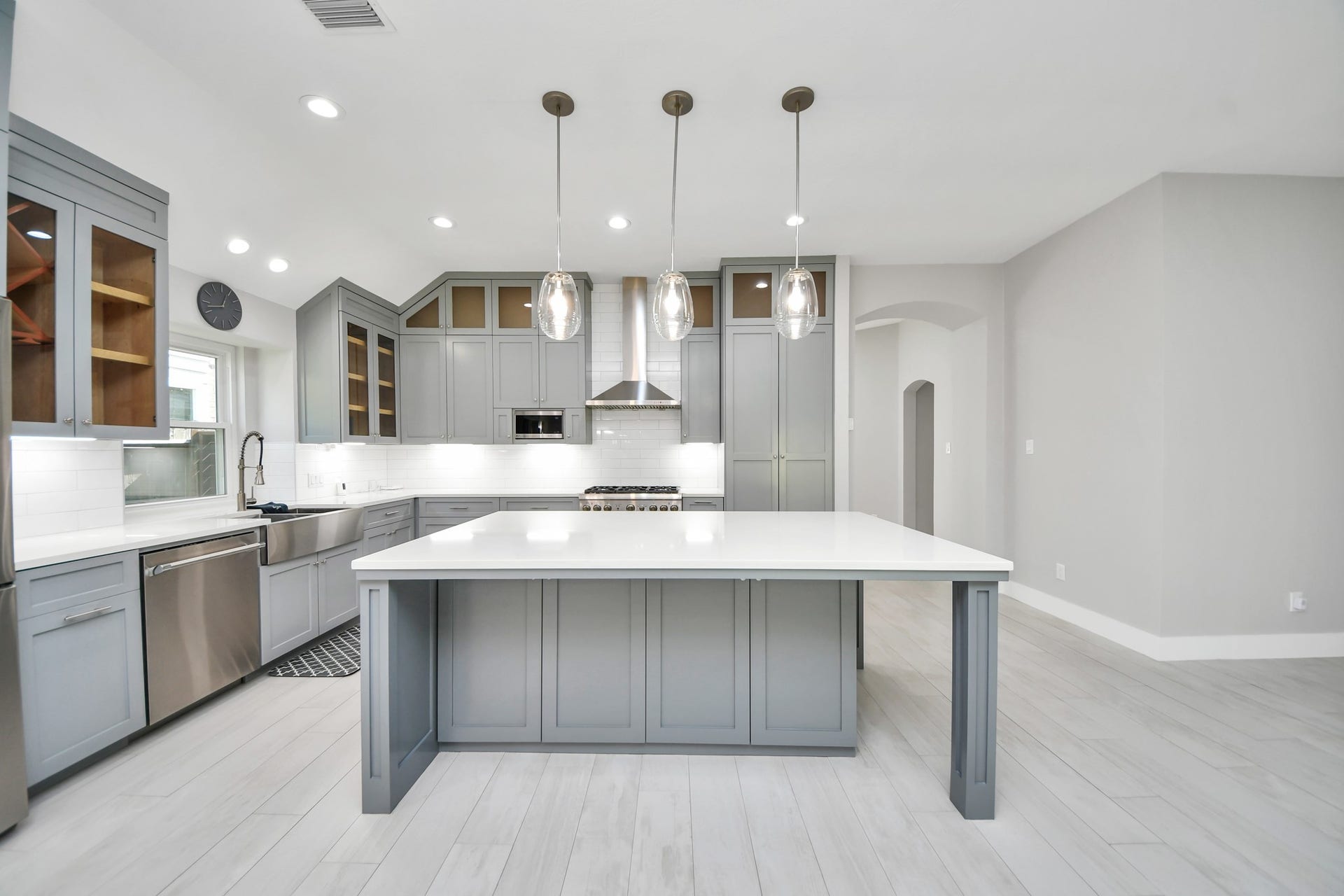 A chefs dream of a kitchen! Open concept and guaranteed to wow with soft closing custom solid wood cabinetry, Thermador 6 burner range, built in microwave, seamless quartz countertops, pendant lights and a vent hood to blow away all your steam.