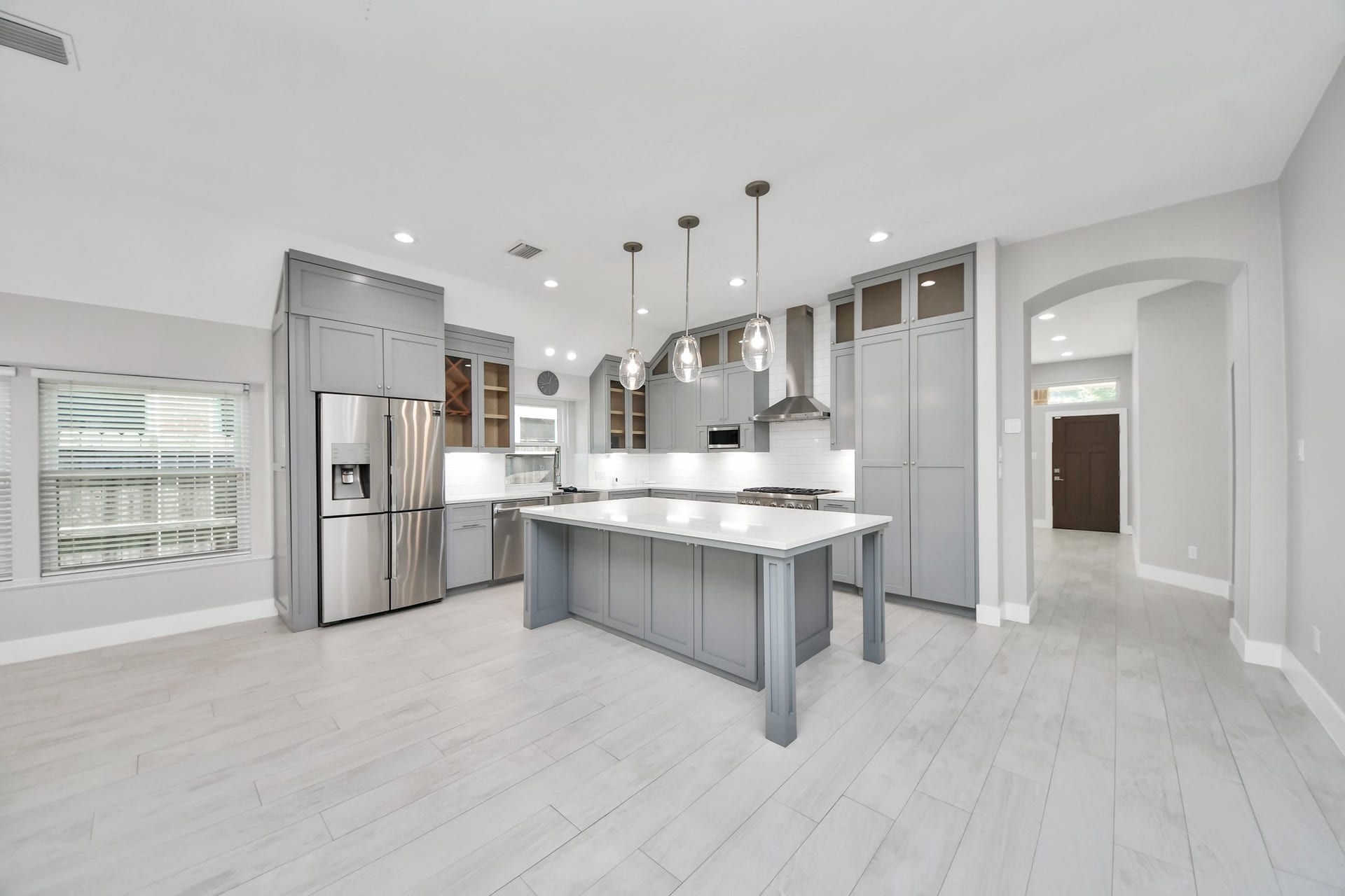 A chefs dream of a kitchen! Open concept and guaranteed to wow with soft closing custom solid wood cabinetry, Thermador 6 burner range, built in microwave, seamless quartz countertops, pendant lights and a vent hood to blow away all your steam.