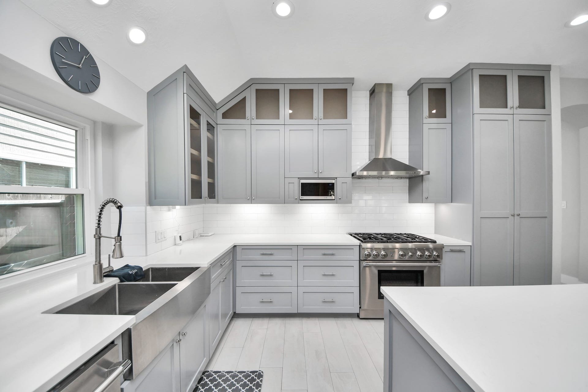 A chefs dream of a kitchen! Open concept and guaranteed to wow with soft closing custom solid wood cabinetry, Thermador 6 burner range, built in microwave, seamless quartz countertops, pendant lights and a vent hood to blow away all your steam.