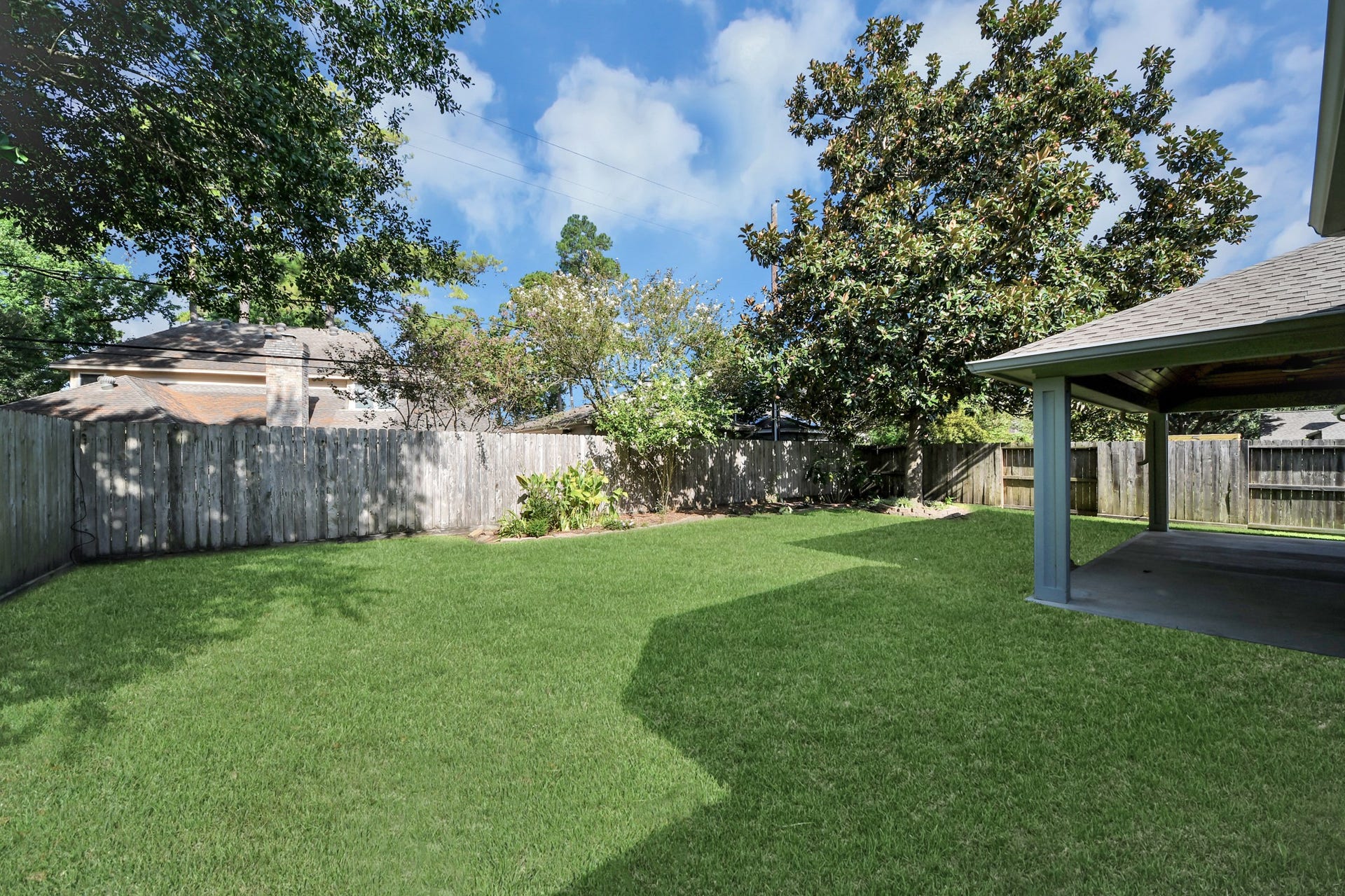 View of the back yard and the back of the home