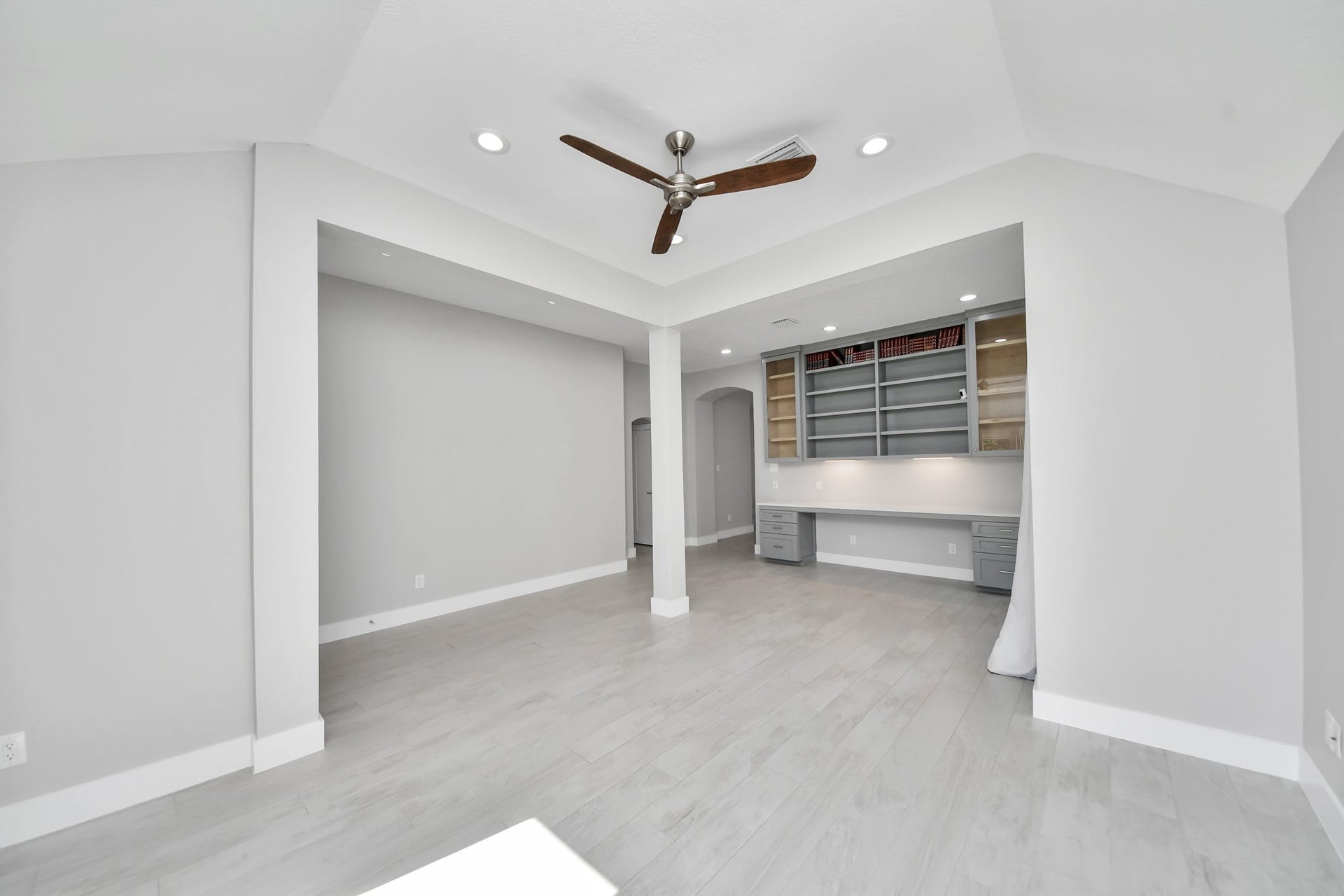 Formal living/seating area and built in library or study all made custom with solid wood.