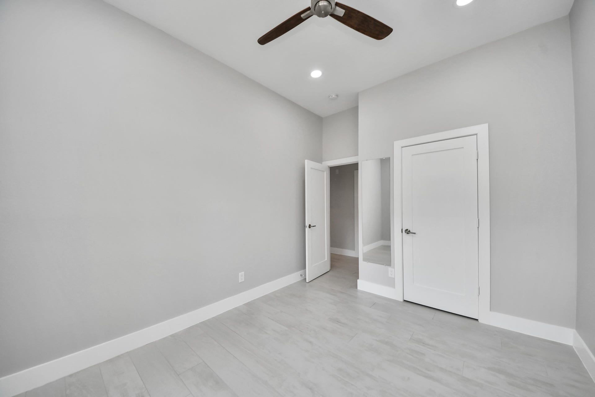 Guest bedroom with updated lights and a upgraded fan