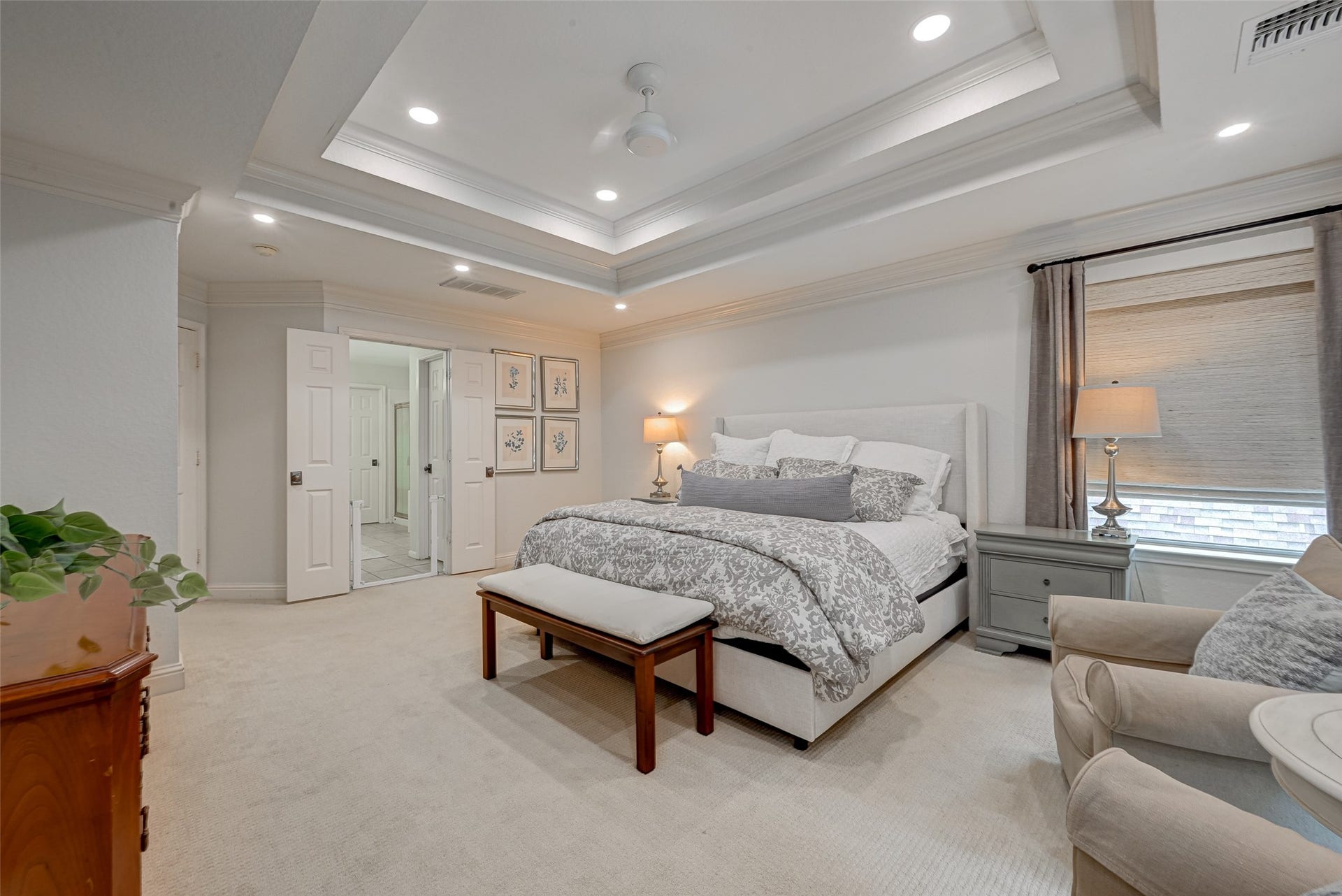 7707 Stone Arbor Drive, Sugar Land, TX 77479 Your own private retreat! Another view of the spacious 2nd-floor Primary Suite highlights the open, airy layout and easy flow into the ensuite bath. Theres plenty of room to move comfortably around a king-size bed, while the soft neutral palette, plush carpet & architectural ceiling details create a restful feel. Double doors open to the ensuite primary bath, completing this private upstairs escape.