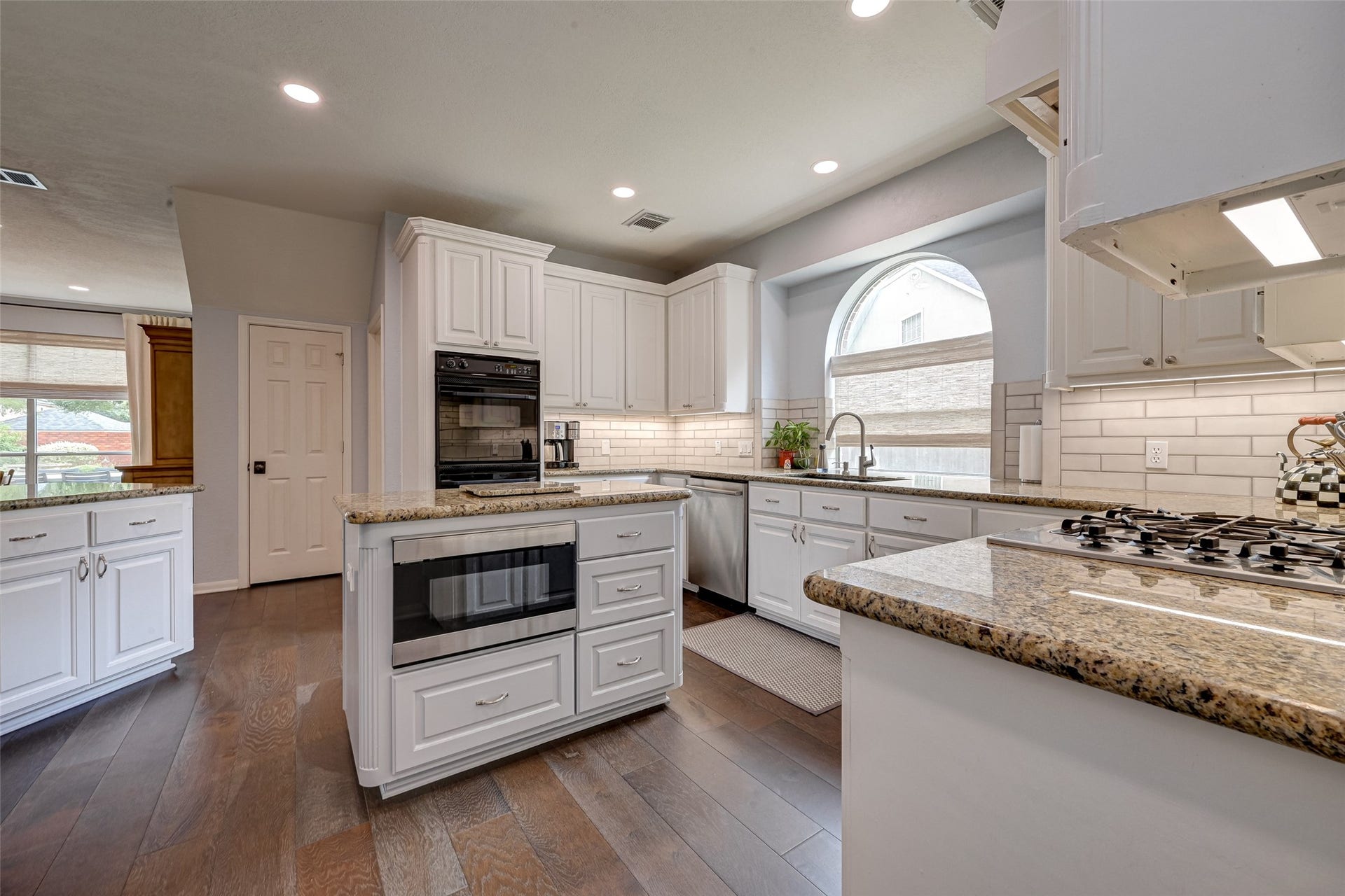 7707 Stone Arbor Drive, Sugar Land, TX 77479 Now THIS is a kitchen designed for real life! The center island adds valuable prep space along with generous storage drawers and a built-in microwave (2023). Its lower placement makes it especially convenient for kids to accessperfect for warming up an after-school snack or helping with meal prep. With abundant cabinetry and countertop space surrounding the island, theres plenty of room for multiple cooks, helpers, and everything that happens in a busy kitchen.