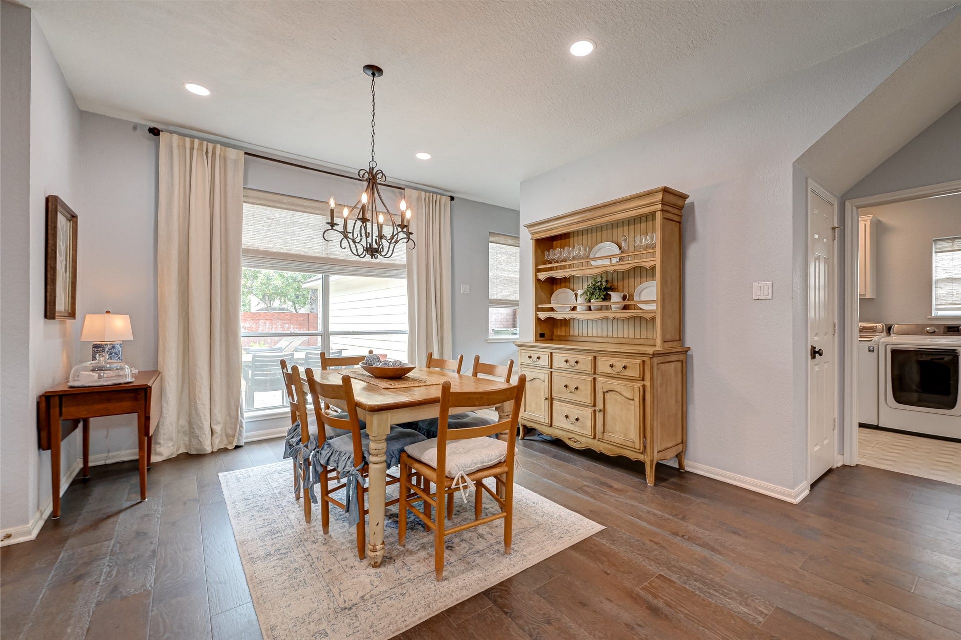 7707 Stone Arbor Drive, Sugar Land, TX 77479 Theres plenty of room to gather here! This spacious breakfast area can easily accommodate a large or expandable table, with additional wall space for a server, bakers rack, or favorite display piece. The utility room is conveniently located just off the space, while the rear staircase provides easy access upstairs. Even betterbeneath the stairs is a large, lighted storage closet, perfect for keeping household extras tucked neatly out of sight.
