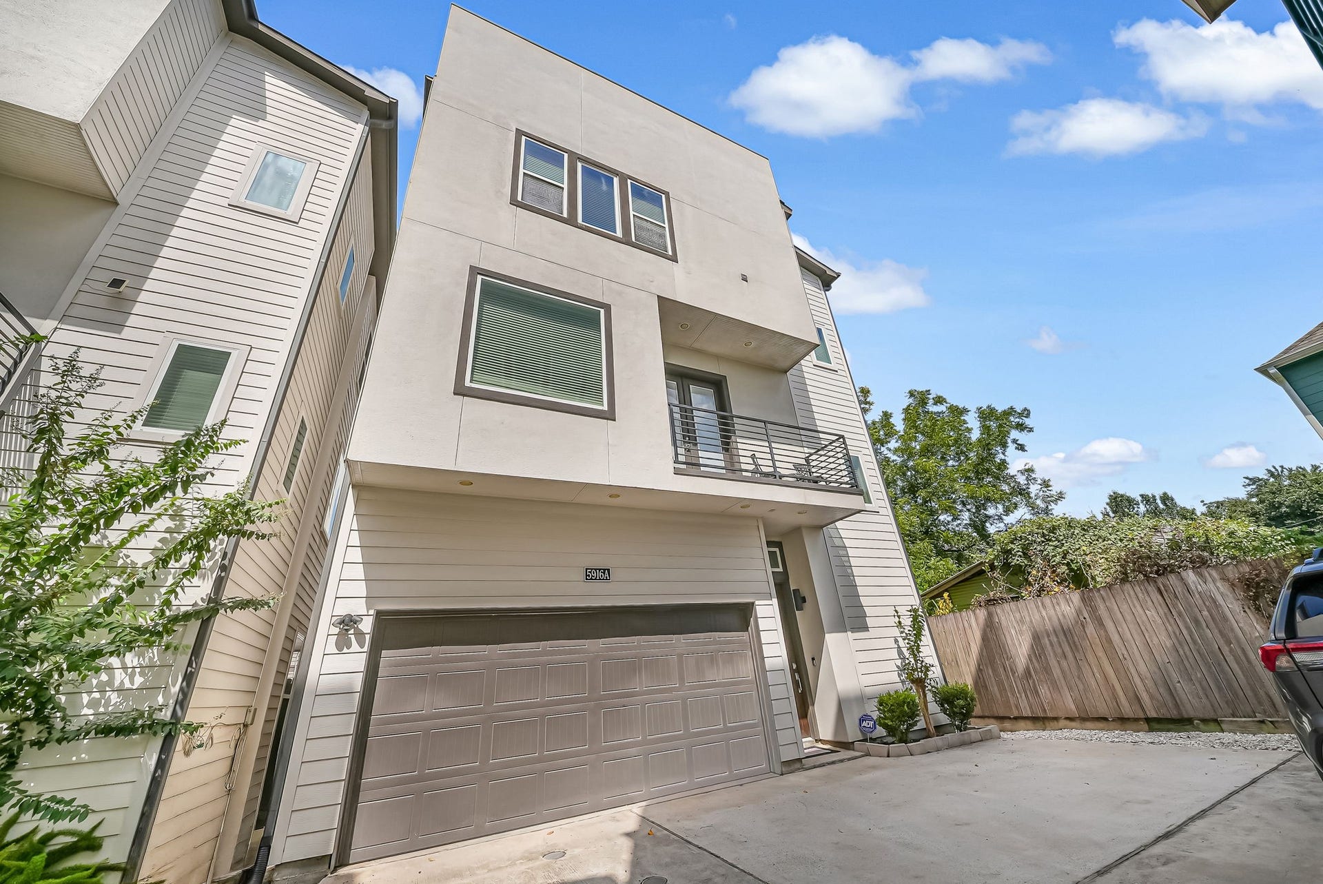 5916 Petty Street, #A, Houston, TX 77007 Private two-car garage with additional parking and direct access to the home's balcony and outdoor living spaces.