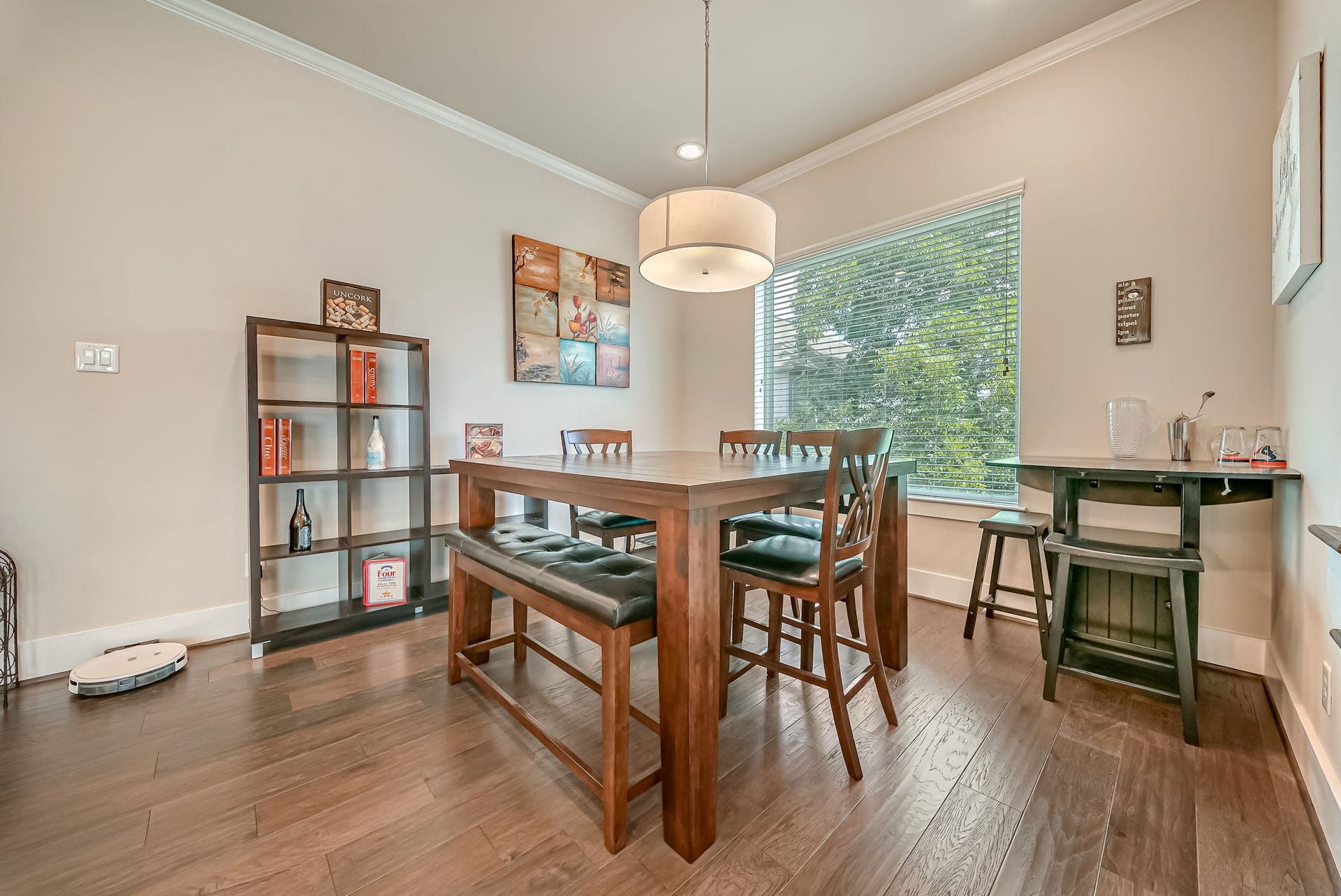 5916 Petty Street, #A, Houston, TX 77007 Spacious dining area featuring abundant natural light and elevated neighborhood views through expansive windows.
