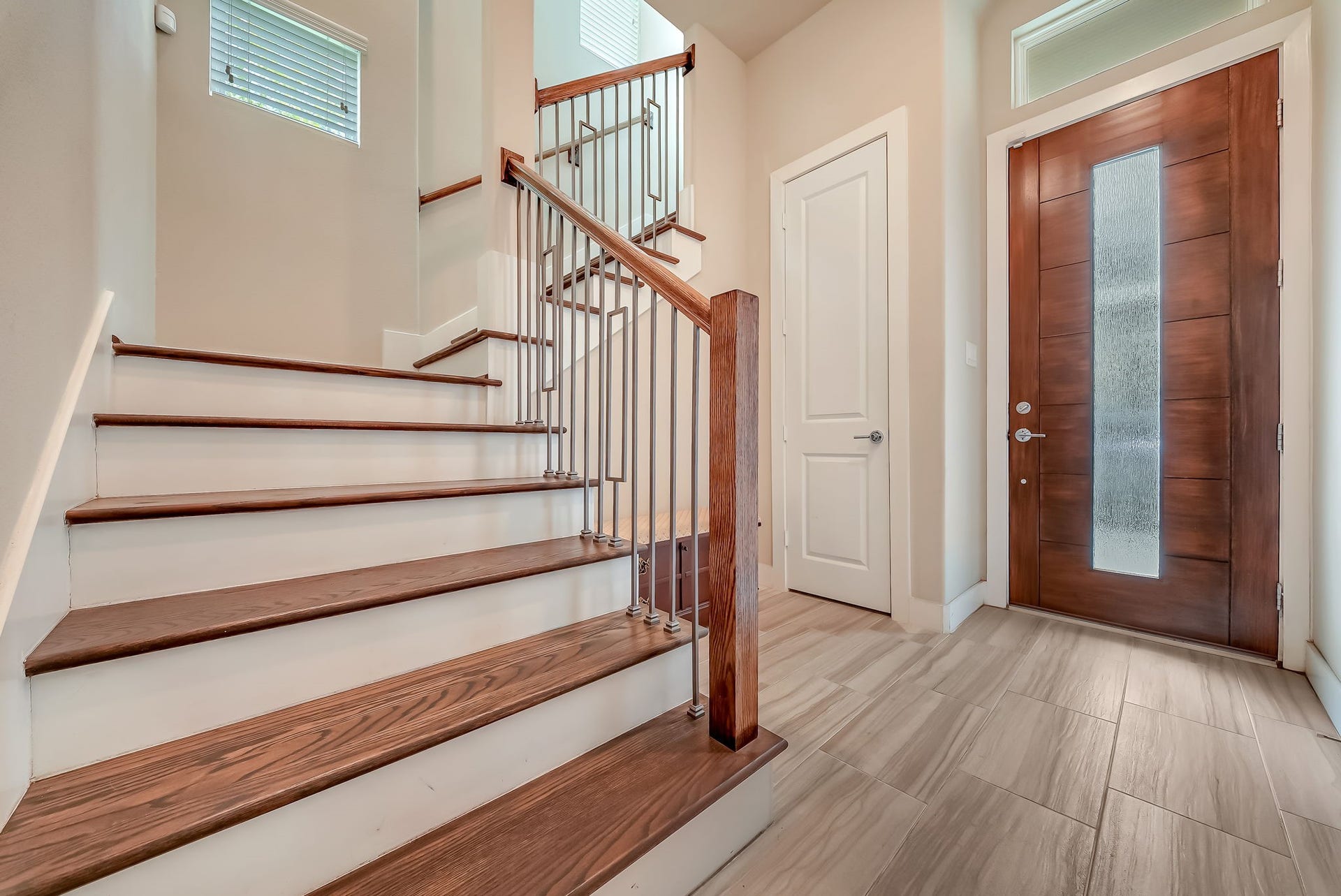 5916 Petty Street, #A, Houston, TX 77007 Dramatic two-story entry with hardwood stairs and an inviting foyer that sets the tone for the home's modern design.