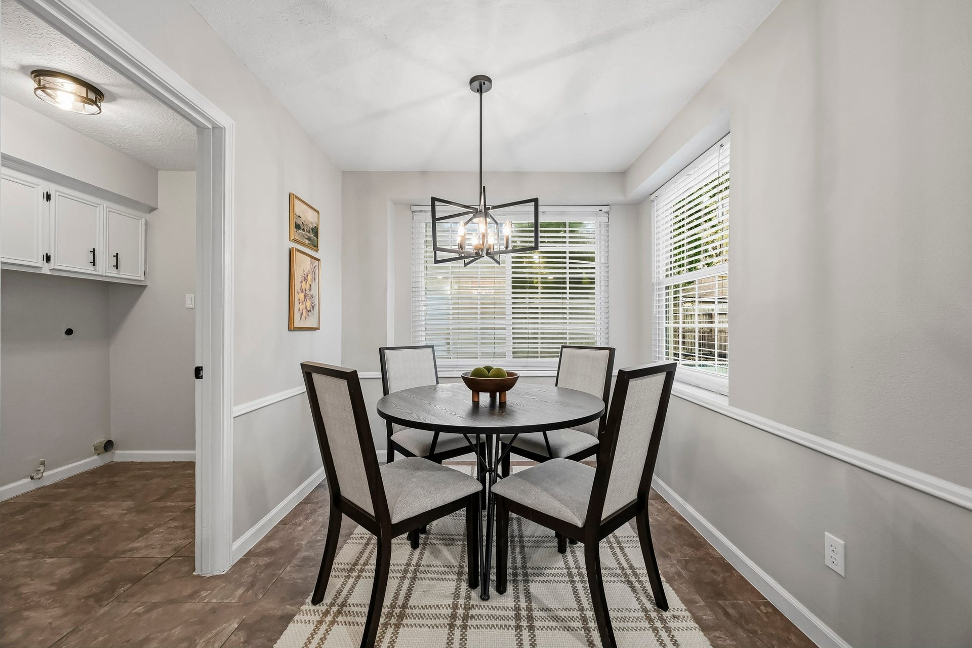 6714 Brittany Park Lane, Houston, TX 77066 Bright and inviting breakfast nook featuring a round table with seating for four, accented by large windows that provide abundant natural light.