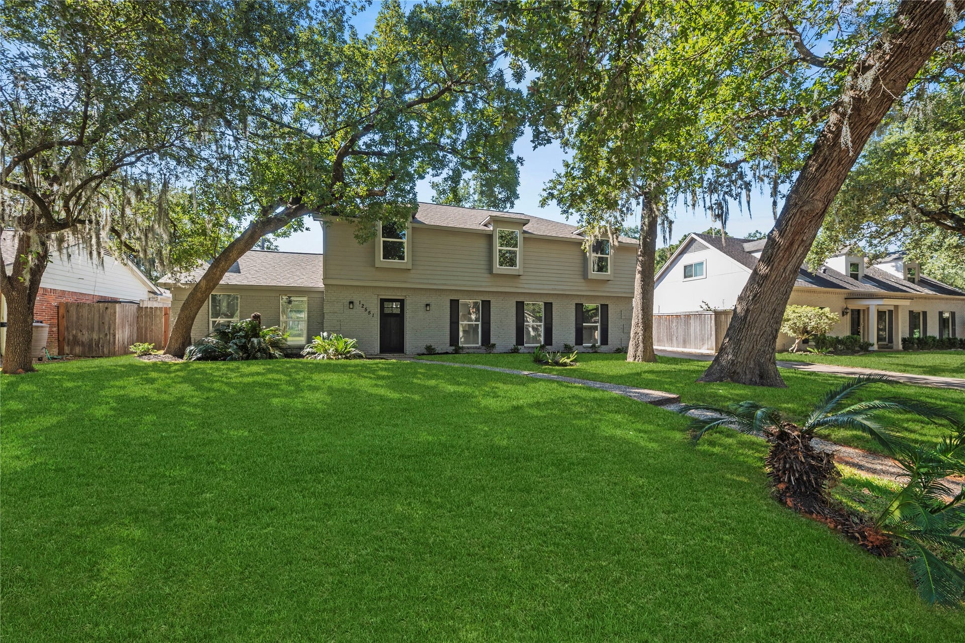 12551 Honeywood Trail, Houston, TX 77077 Completely renovated 2-story home in highly desired Ashford Forest. Grass has been enhanced to show potential.