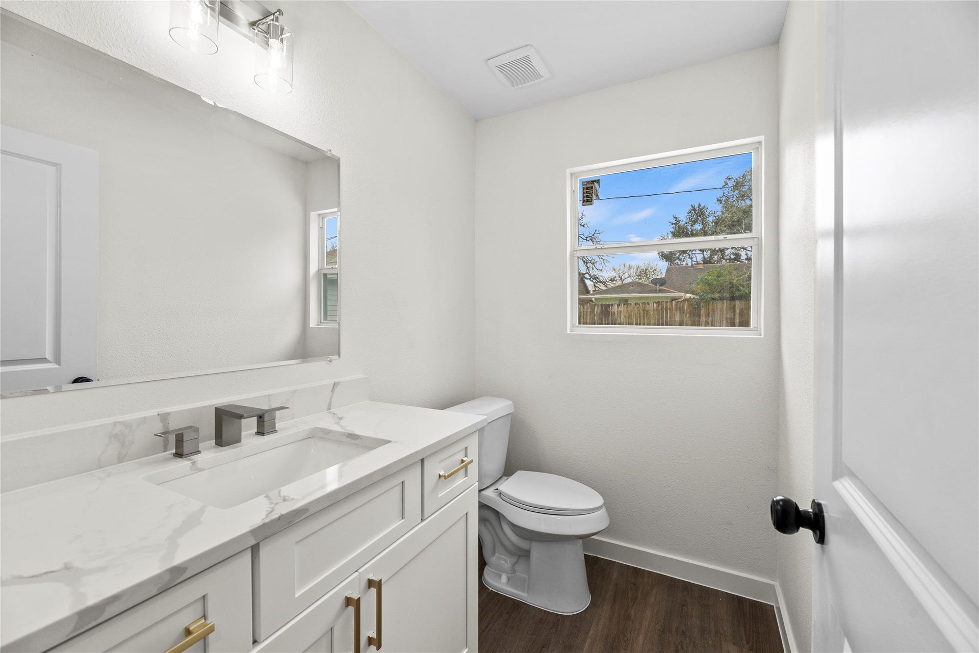 12551 Honeywood Trail, Houston, TX 77077 Downstairs half bathroom with a new vanity, hardware and fixtures.