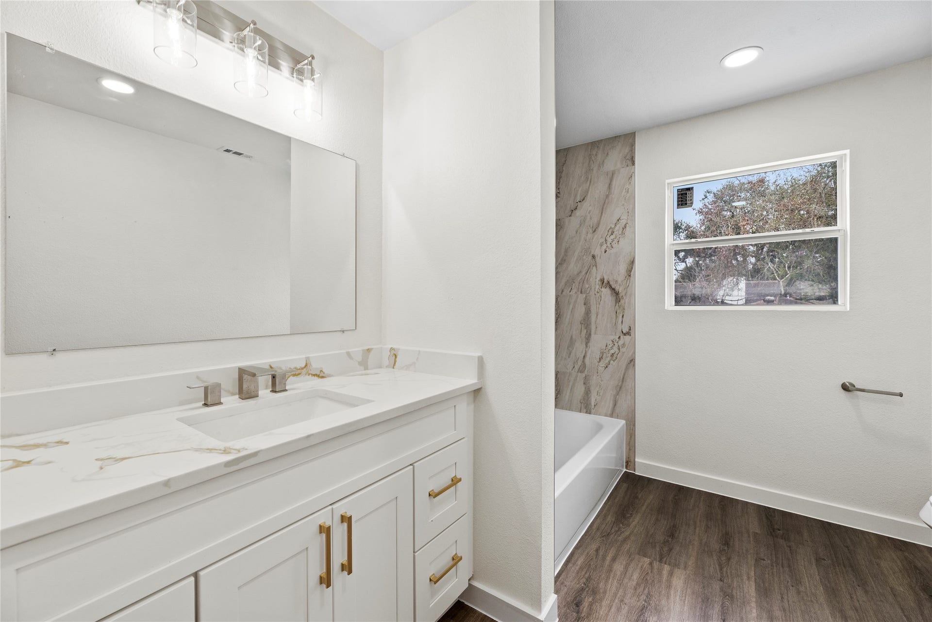 12551 Honeywood Trail, Houston, TX 77077 Upstairs full bathroom with a new vanity, hardware and fixtures.