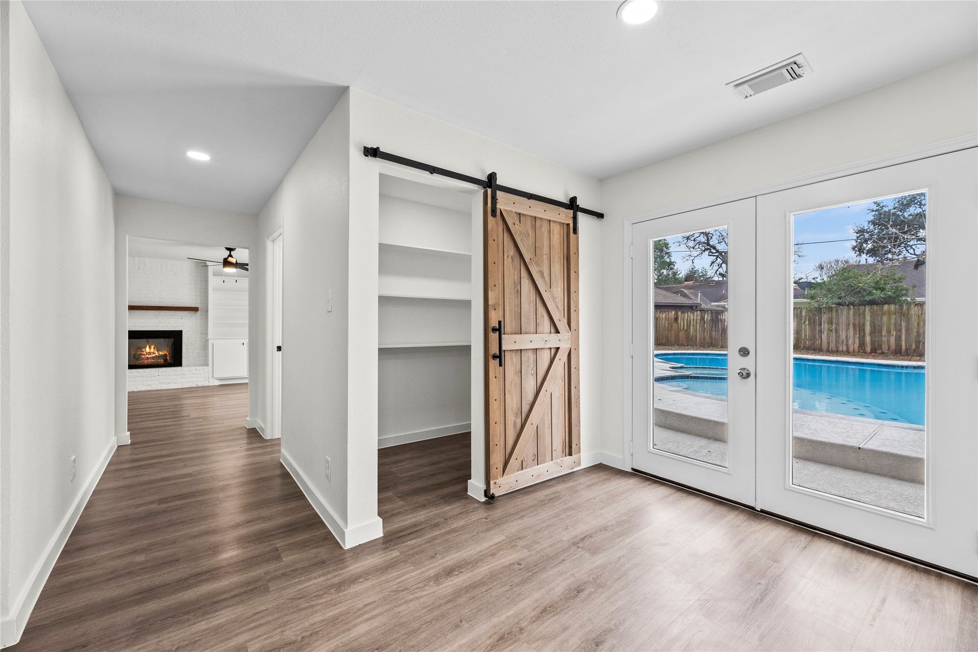 12551 Honeywood Trail, Houston, TX 77077 Walk-in pantry with a barn door.