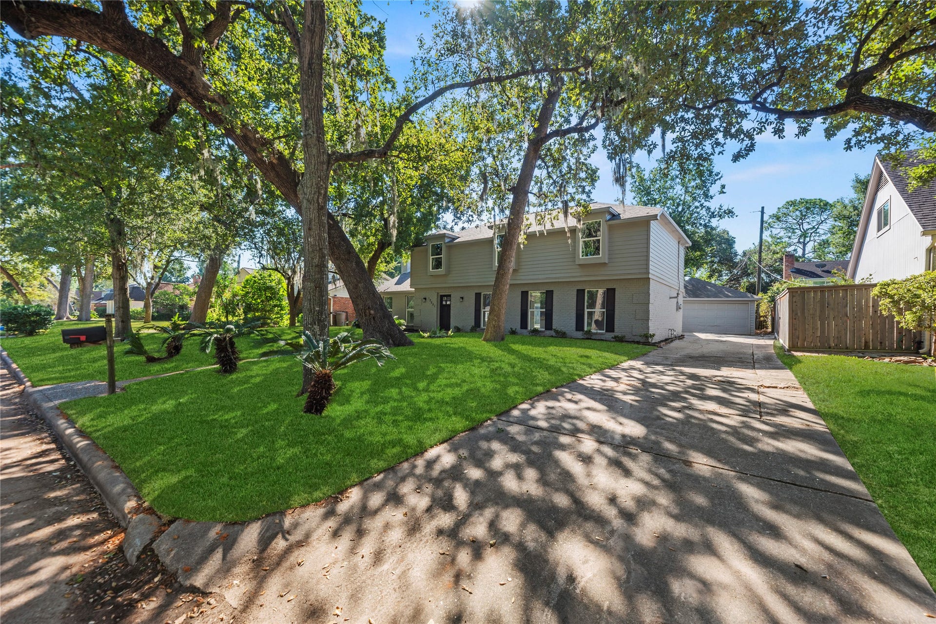 12551 Honeywood Trail, Houston, TX 77077 Long driveway leads to a detached 2-car garage.
