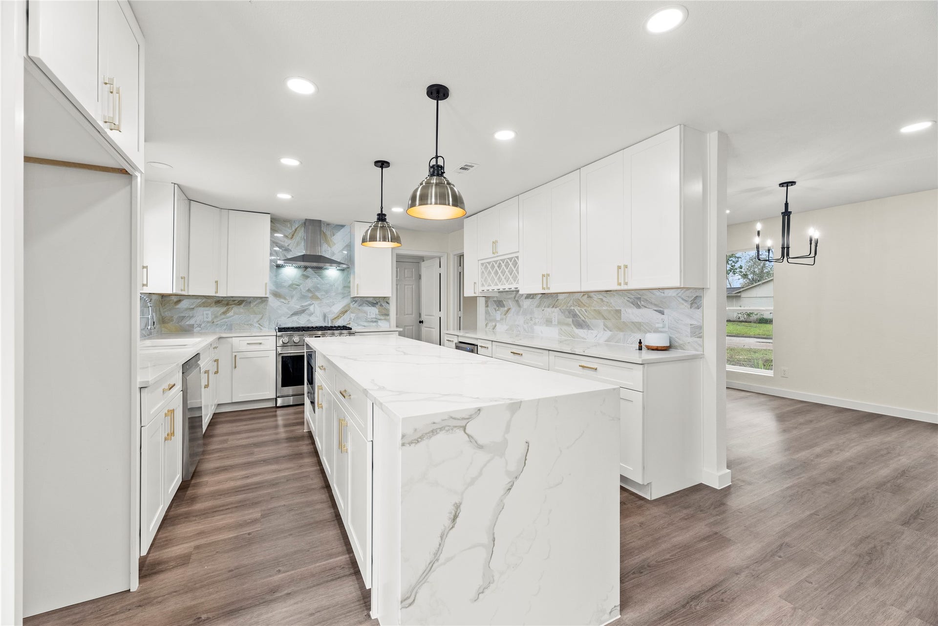 12551 Honeywood Trail, Houston, TX 77077 Renovated kitchen features stunning Quartz countertops, stainless steel appliances, new cabinetry, built-in wine rack, wine fridge, new fixtures and hardware.