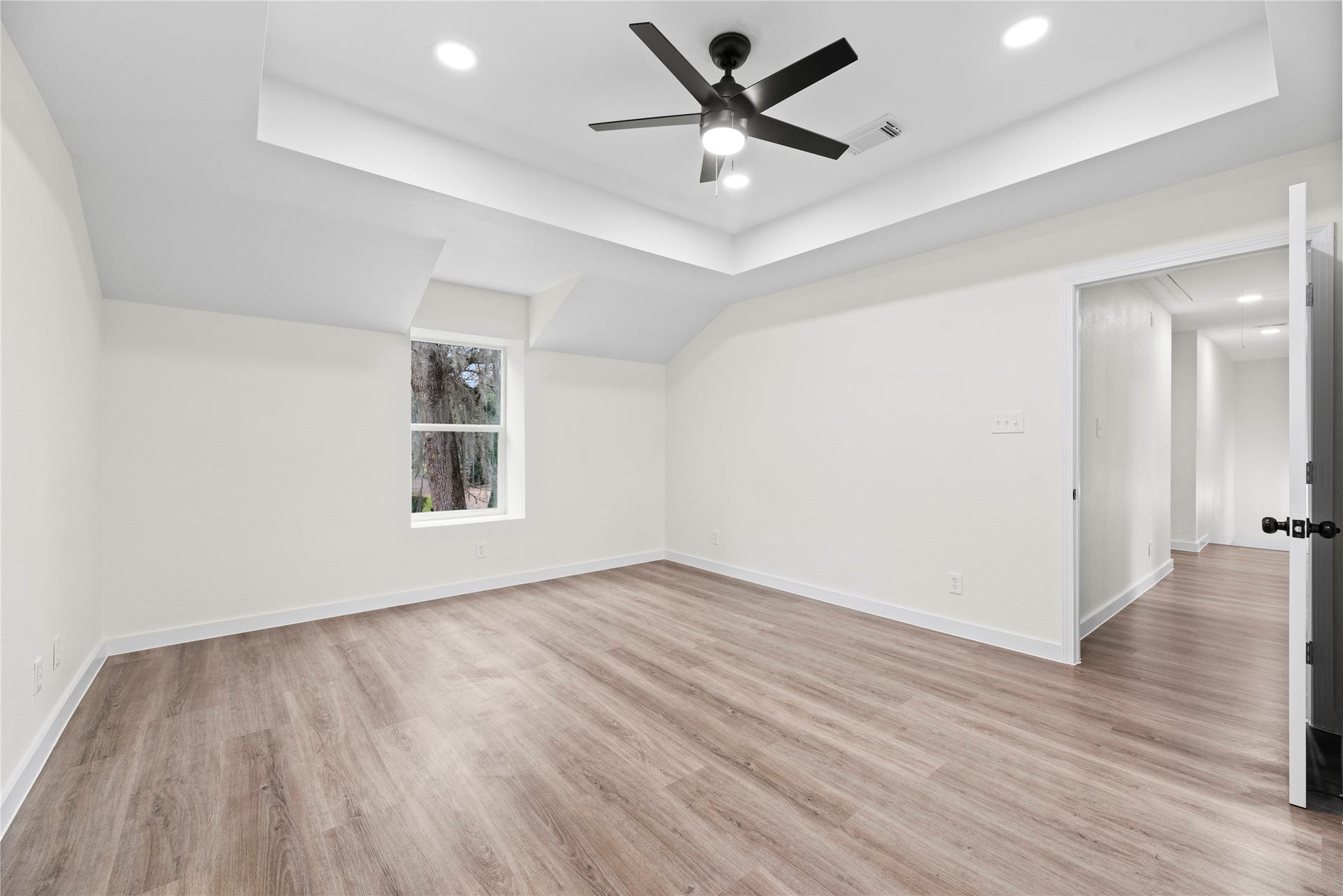 12551 Honeywood Trail, Houston, TX 77077 Primary bedroom conveniently located upstairs with a tray ceiling, walk-in closet and en-suite bathroom.