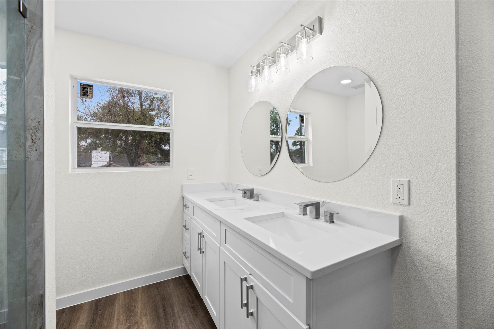 12551 Honeywood Trail, Houston, TX 77077 Dual sink quartz vanity with new fixtures and hardware.