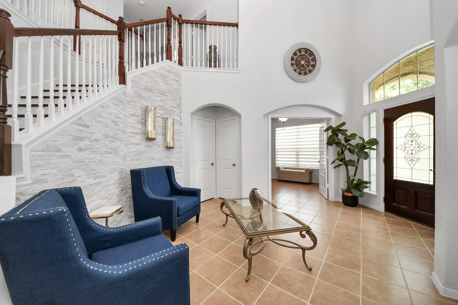 8519 E Windhaven Terrace Trail, Cypress, TX 77433 Grand foyer with soaring ceiling and an elegant staircase welcomes you into this stunning lakefront home