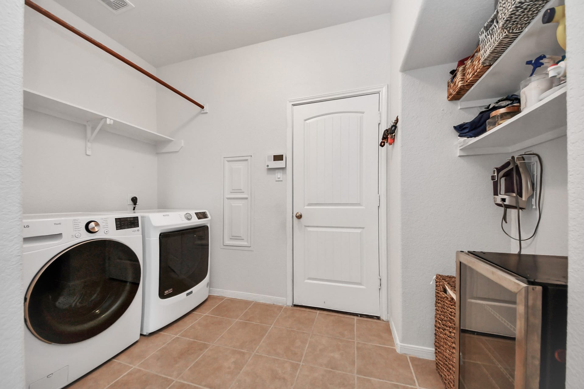 8519 E Windhaven Terrace Trail, Cypress, TX 77433 large utility room located inside the house