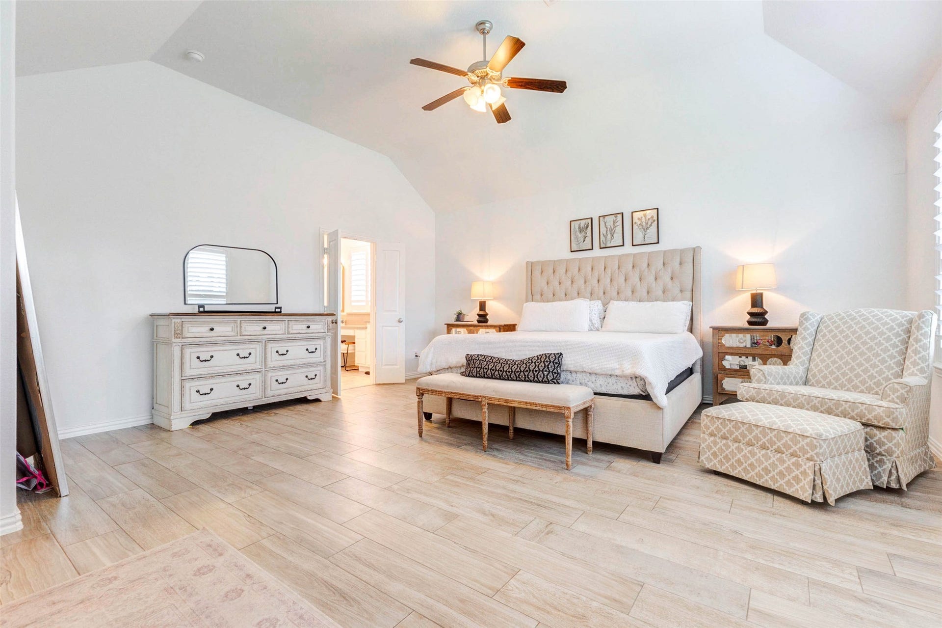 Enjoy the expansive feel of this oversized primary bedroom, complete with high ceilings and plenty of room for additional seating or dcor. The open layout connects seamlessly to the ensuite bathroom, offering convenience and flow. Light flooring and neutral tones create a bright, airy ambiance, while the thoughtful design makes this space both functional and relaxing for everyday living.