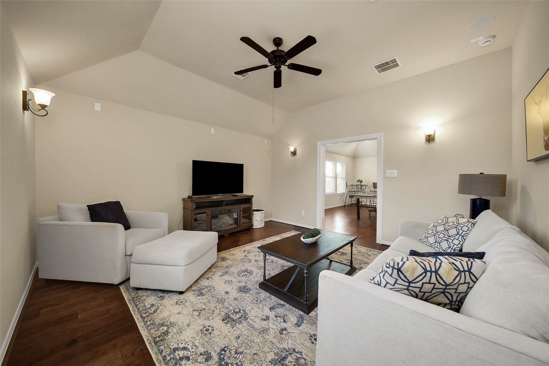 5318 Briarcliff Lane, Fulshear, TX 77441 Directly adjacent to the game room, the dedicated media room features a convenient AV closet, making it the perfect setup for movie nights and immersive entertainment.