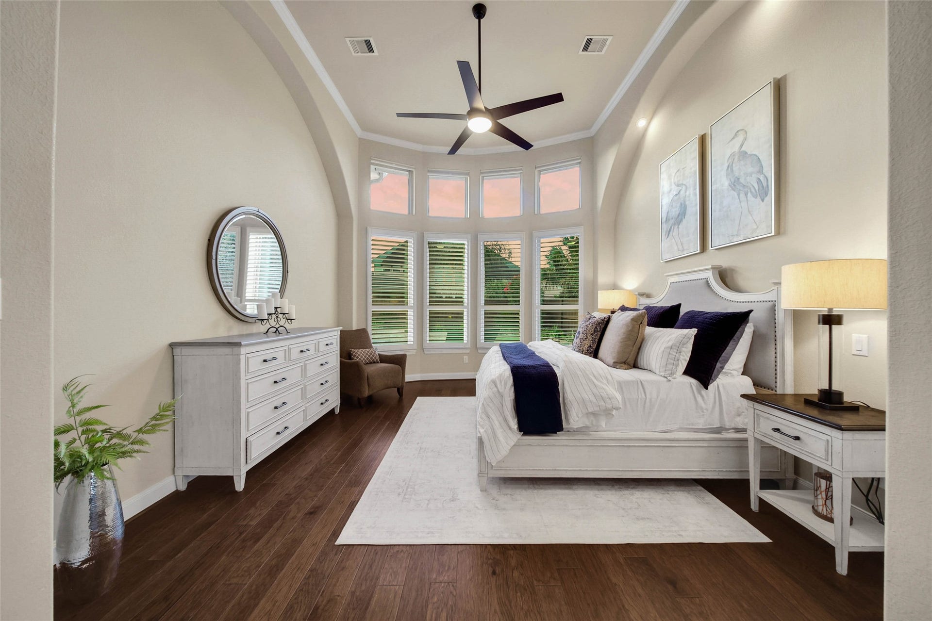 5318 Briarcliff Lane, Fulshear, TX 77441 Volume ceilings enhance the primary bedroom, creating an airy, spacious feel that adds to the suites relaxing retreat-like ambiance.