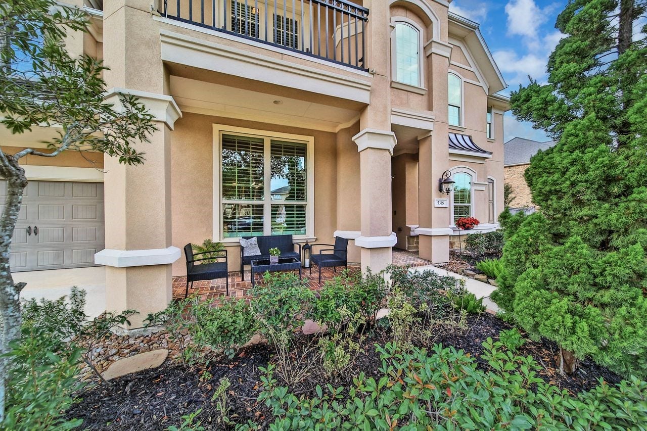5318 Briarcliff Lane, Fulshear, TX 77441 The charming front porch offers the perfect spot to sip morning coffee or unwind with a glass of wine, and reflect on the day while enjoying a beautiful evening sunset.