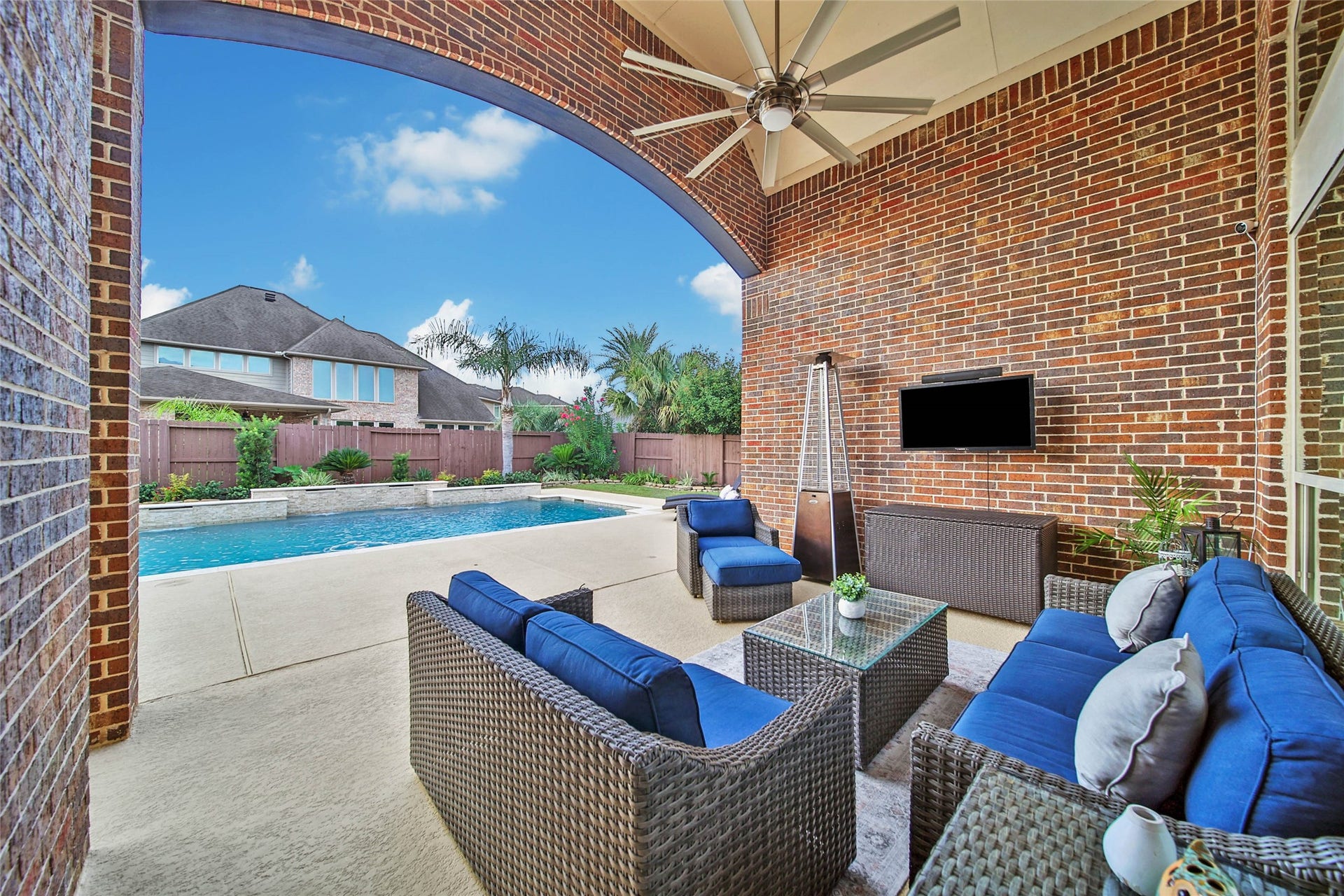 5318 Briarcliff Lane, Fulshear, TX 77441 Step outside to one of the inviting covered patio areas, where lovely views of the backyard and pool create the perfect setting for relaxing or entertaining year-round.