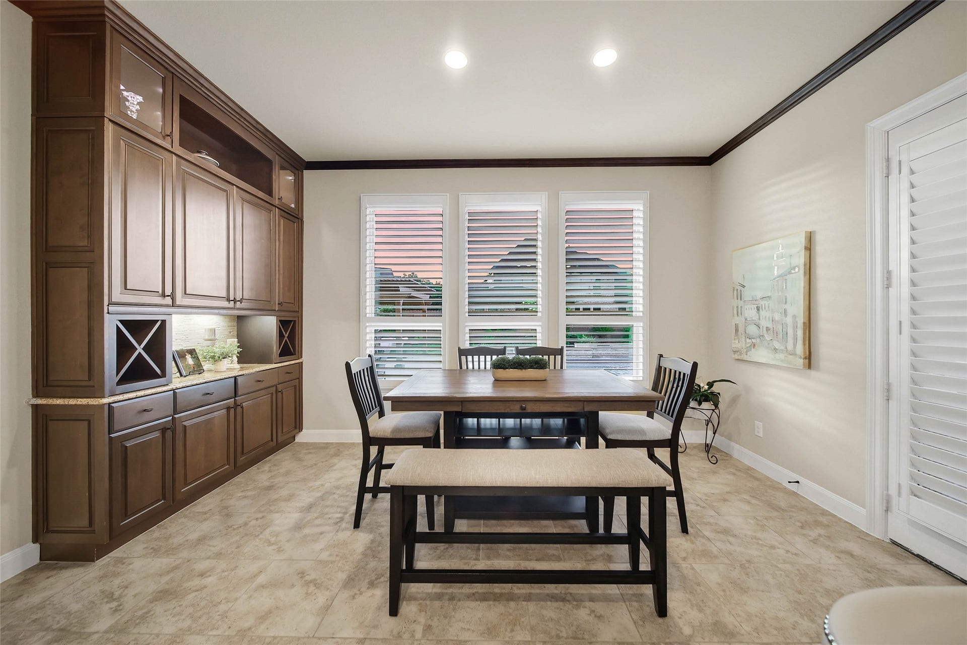5318 Briarcliff Lane, Fulshear, TX 77441 The breakfast rooms built-in buffet counter and cabinetry are a fabulous upgrade, offering convenient storage and the perfect serving station for meals. An oversized utility room with built ins and space for a 2nd refrigerator is located just off the breakfast nook.