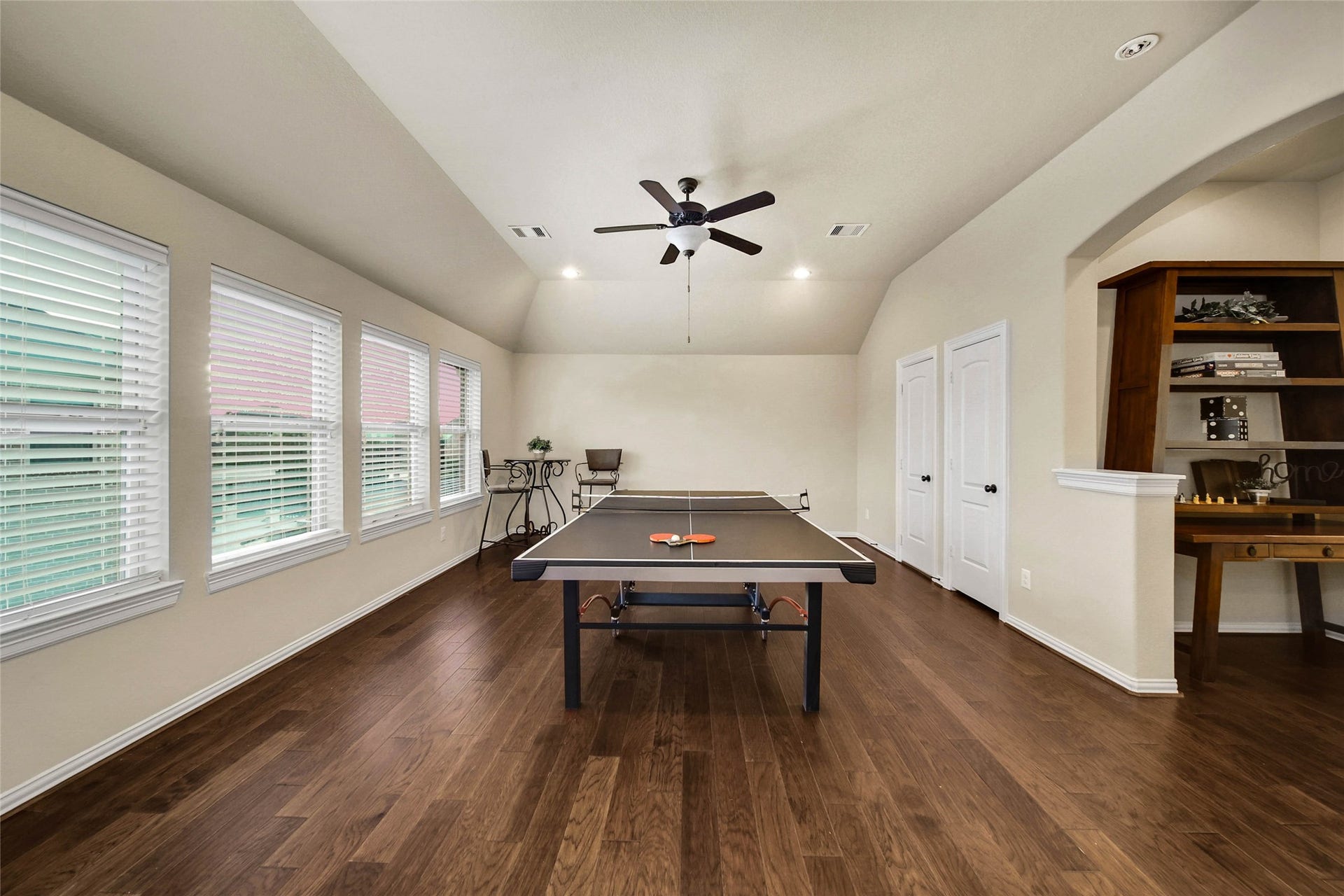 5318 Briarcliff Lane, Fulshear, TX 77441 Plenty of space for all the FUN you have in mind! The spacious game room offers a convenient storage closet and walk-in attic access, providing valuable extra space to keep everything organized. Bonus- Ping Pong Table Stays!