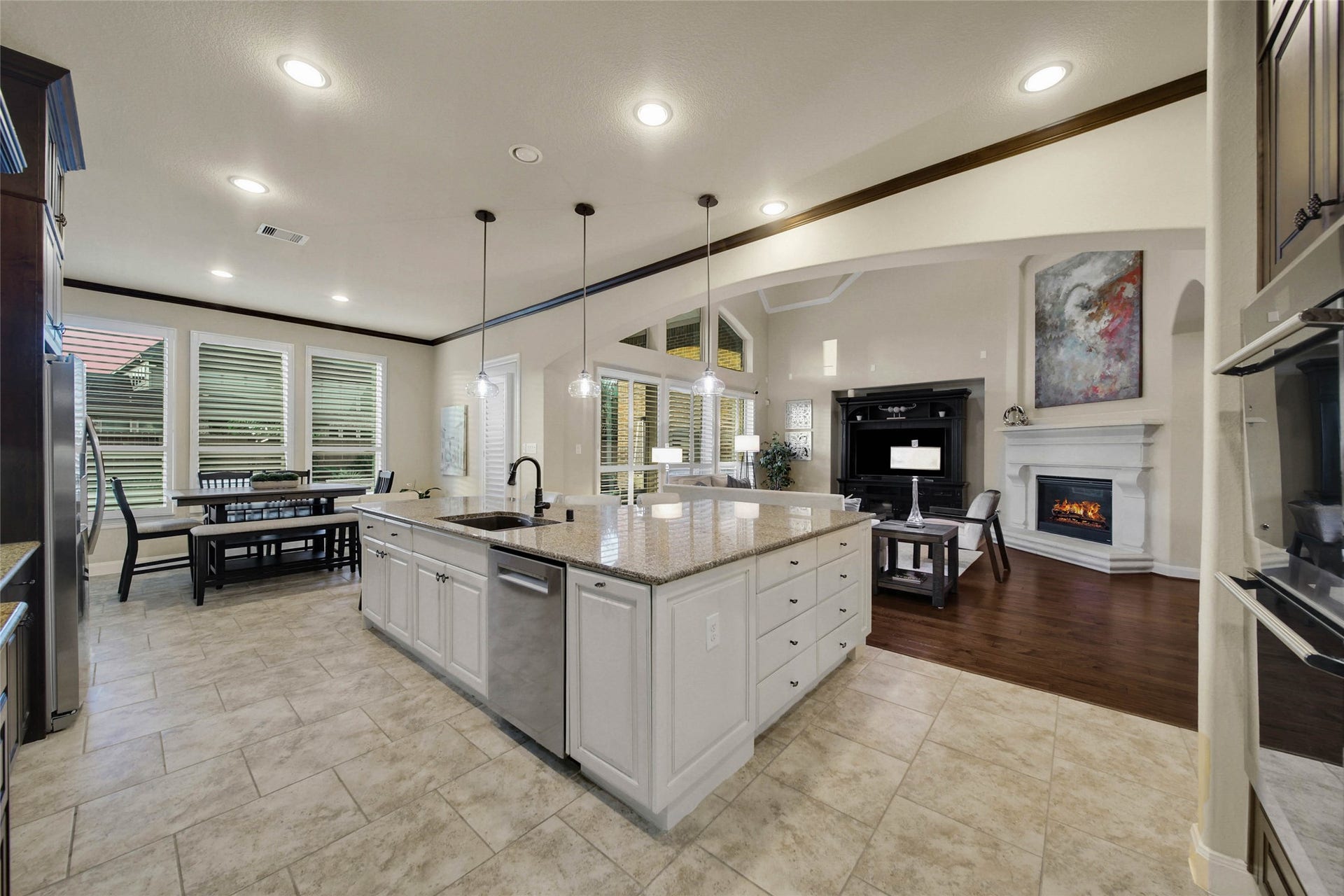 5318 Briarcliff Lane, Fulshear, TX 77441 The kitchen opens seamlessly to the living room, creating an inviting, open-concept space where everyone can stay connected and part of the conversation, whether cooking, relaxing, or entertaining.