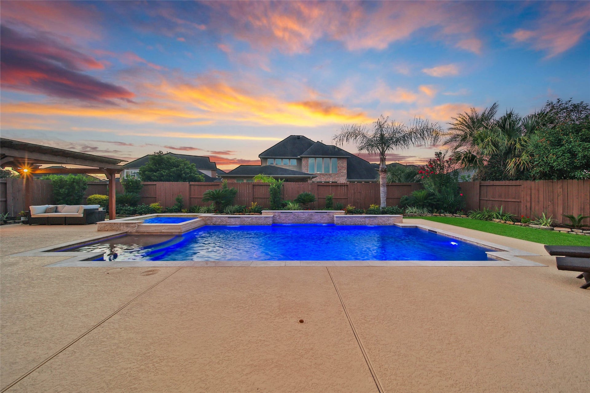 5318 Briarcliff Lane, Fulshear, TX 77441 The approximately 24,000-gallon heated saltwater pool and spa create a stunning backyard oasis, while three sheer-descent waterfalls provide the soothing sounds of cascading water for a truly relaxing retreat.