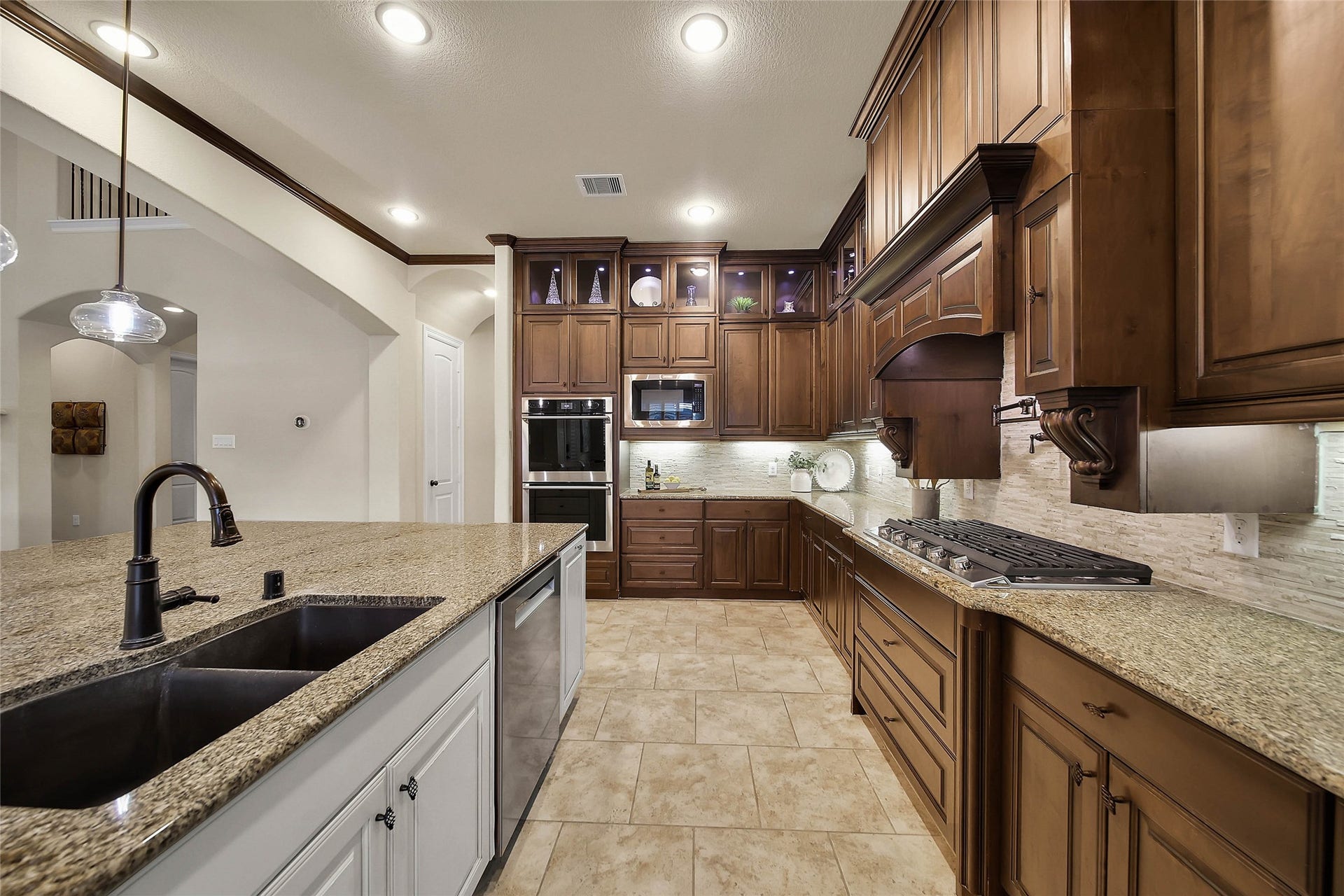 5318 Briarcliff Lane, Fulshear, TX 77441 Electrolux double ovens (2026) and a Bosch dishwasher (2025) complete the suite of stainless steel appliances, adding both style and functionality to this well-appointed kitchen.