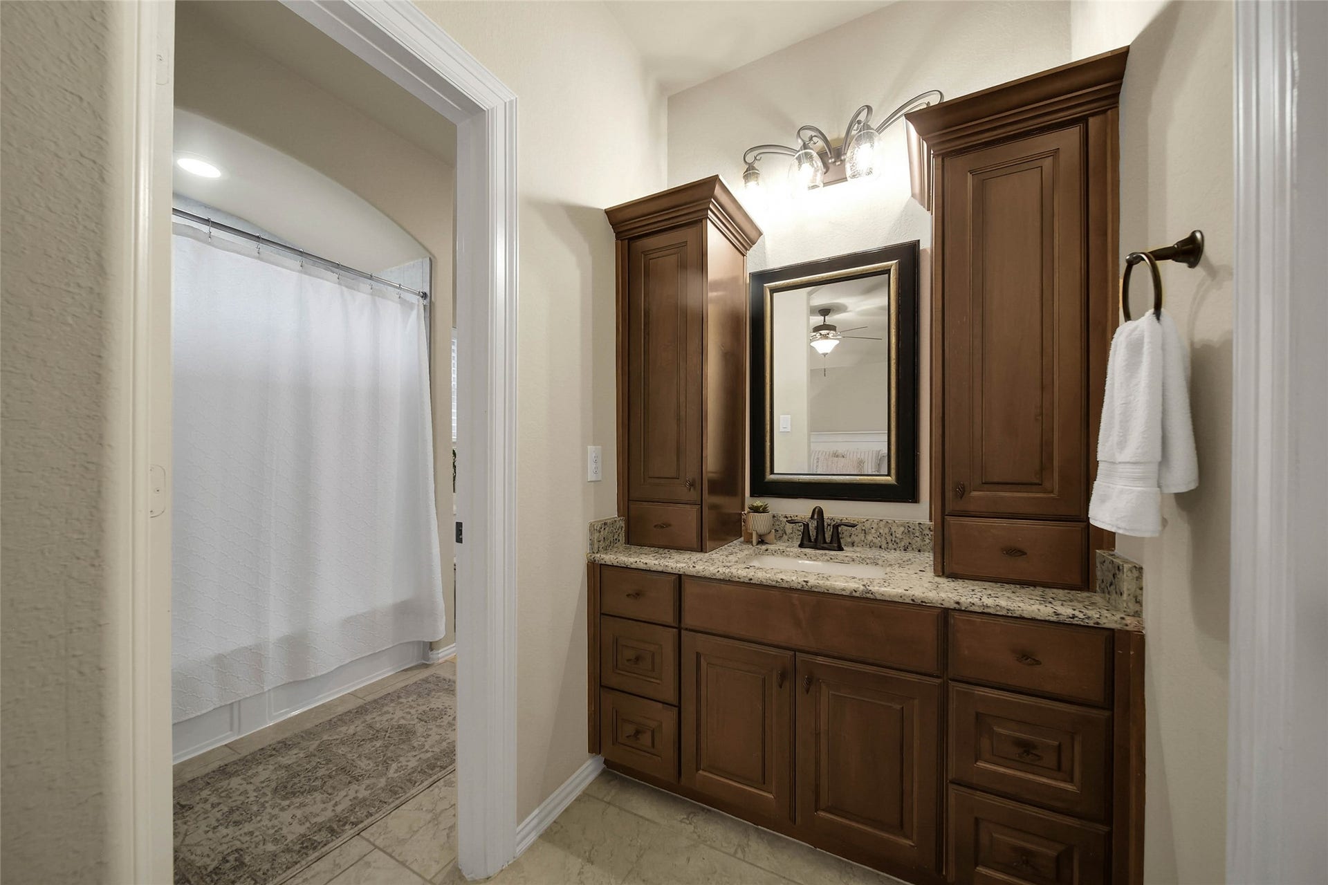 5318 Briarcliff Lane, Fulshear, TX 77441 This bedroom features a private vanity area and connects to Bedroom 4 through a convenient shared bathroom, offering both functionality and privacy.