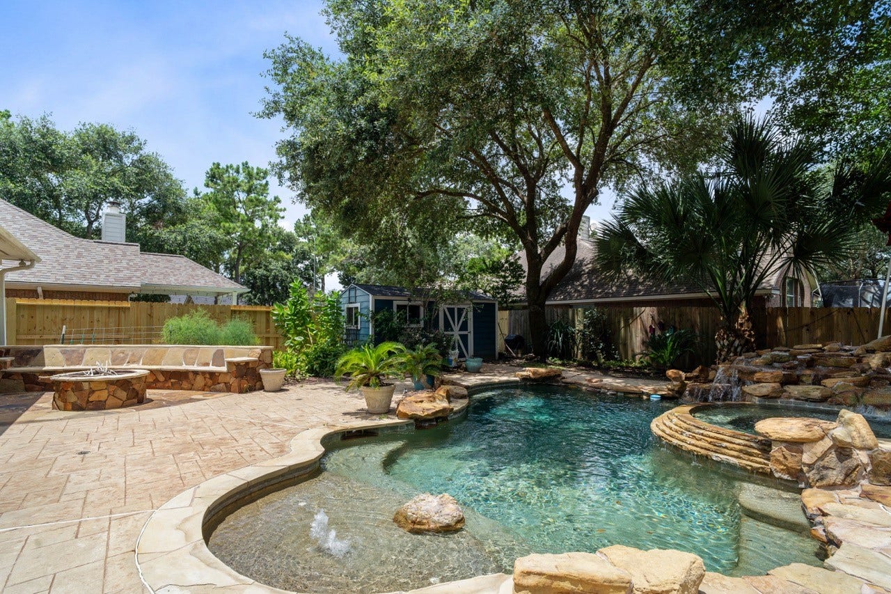 20406 Ranger Point Court, Katy, TX 77450 Welcome home to Paradise. Pool, Spa, Sunbath area, Firepit, Living Garden of fruits and Vegetables and more!