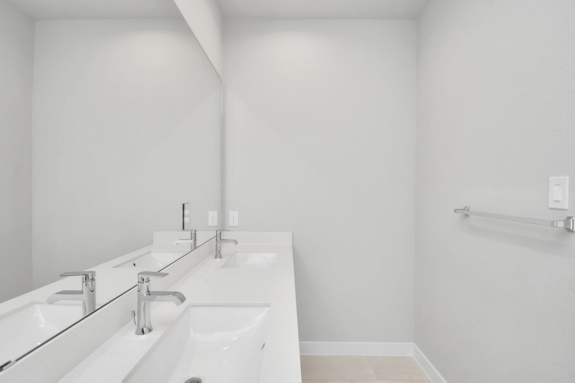 16007 Sycamore Maple Lane, Cypress, TX 77429 Elevate your daily routine at the elegant vanity, now equipped with double sinks, light countertops, modern hardware, and beautiful recessed lights. Sample photo of completed home with similar floor plan. Actual colors and selections may vary.