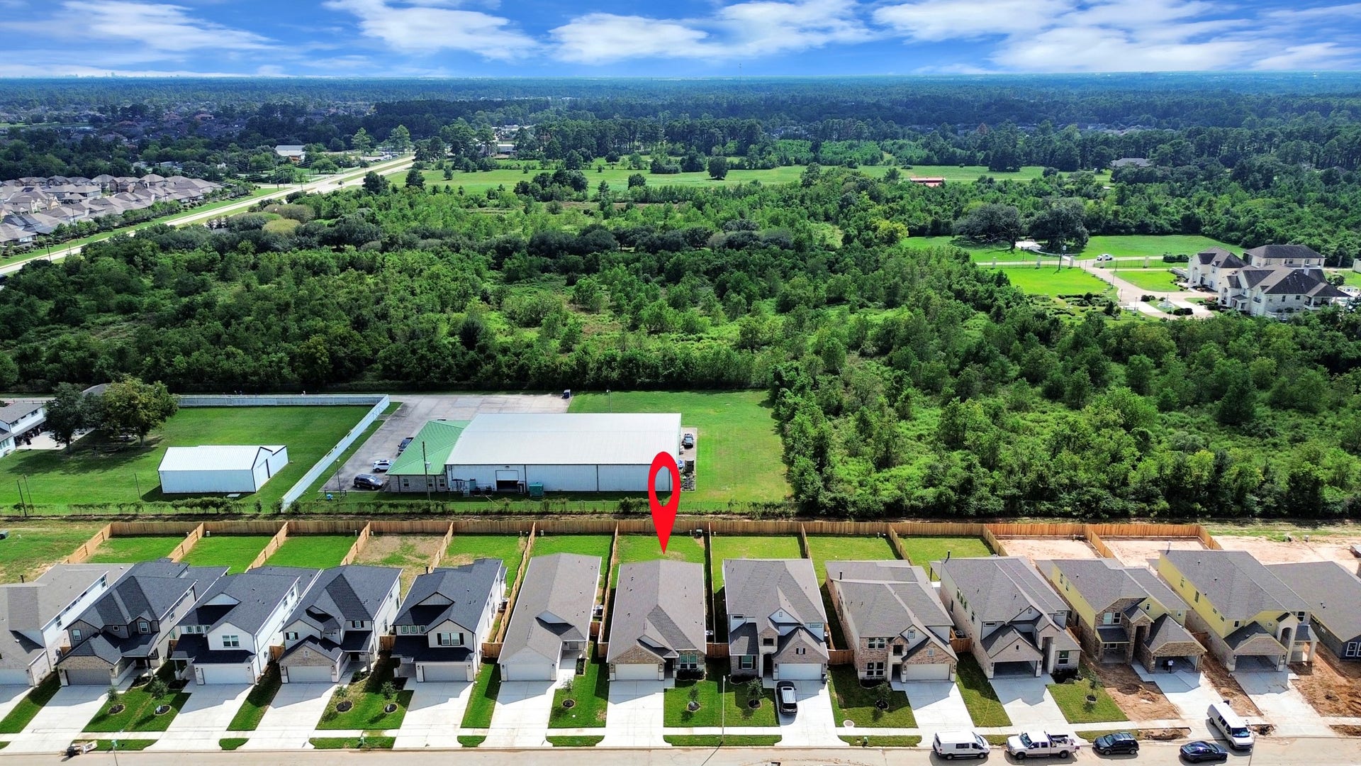 16007 Sycamore Maple Lane, Cypress, TX 77429 An aerial view of a spacious subdivision lot, highlighting a well-maintained yard and a fully fenced perimeter, offering both privacy and expansive outdoor space.