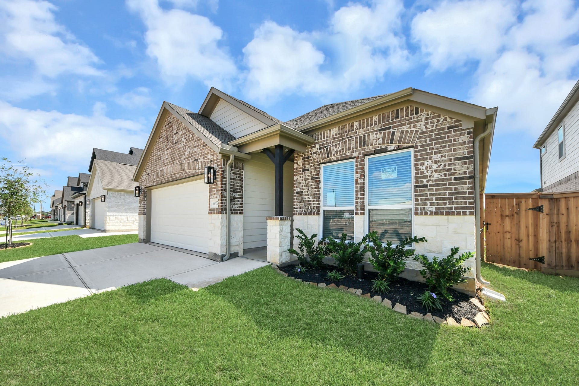 16007 Sycamore Maple Lane, Cypress, TX 77429 Home features a convenient 2-car garage complemented by a spacious driveway, offering ample parking for you and your guests.