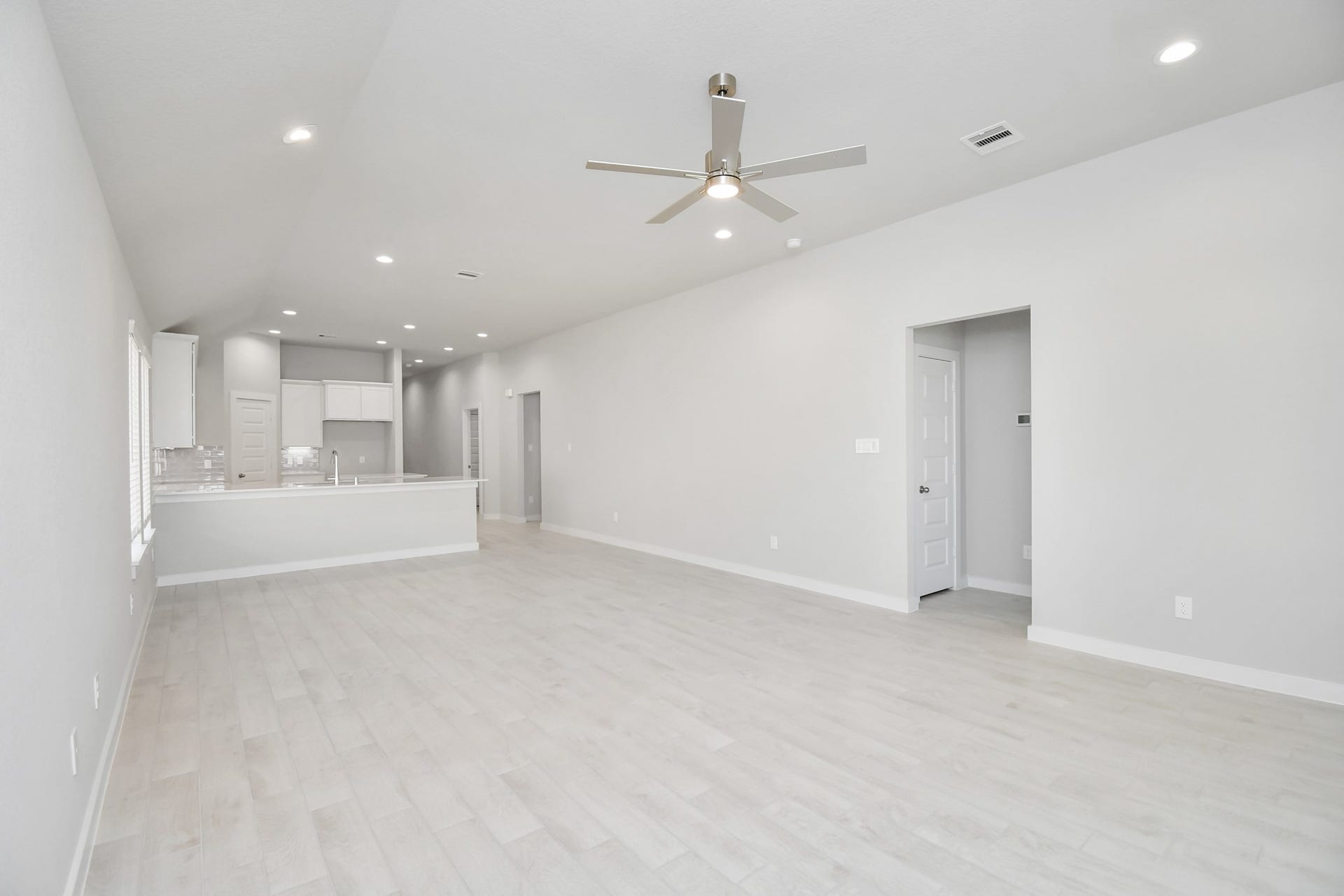 16007 Sycamore Maple Lane, Cypress, TX 77429 View from the family room to the kitchen and dining area! Sample photo of completed home with similar floor plan. Actual colors and selections may vary.