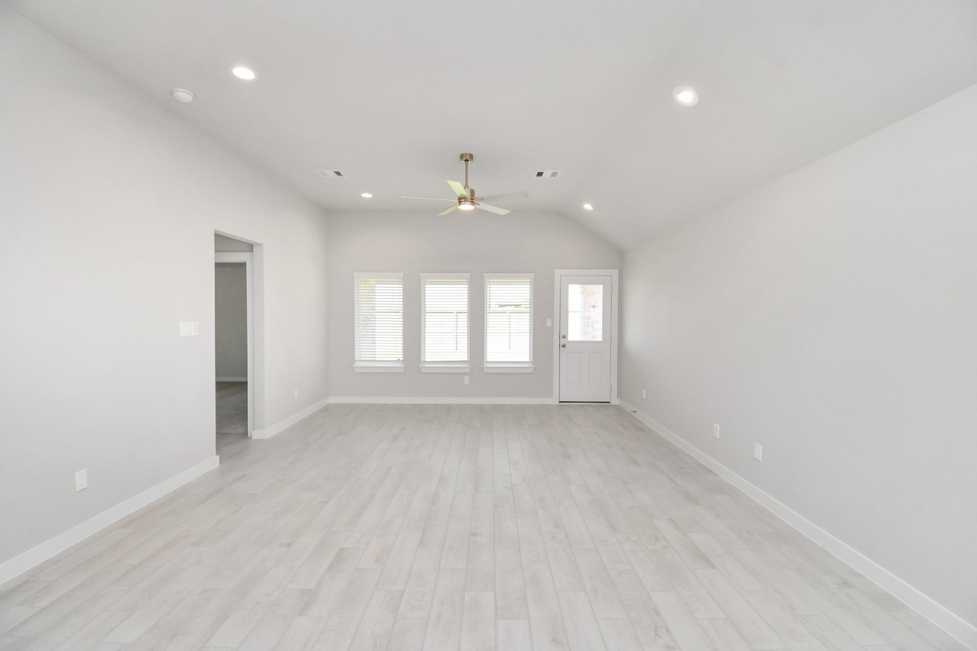 16007 Sycamore Maple Lane, Cypress, TX 77429 Family room flooded with natural light through the expansive windows. The premium tile flooring adds a touch of luxury to the space, creating the perfect setting for relaxing moments and cherished gatherings with loved ones. Sample photo of completed home with similar floor plan. Actual colors and selections may vary.