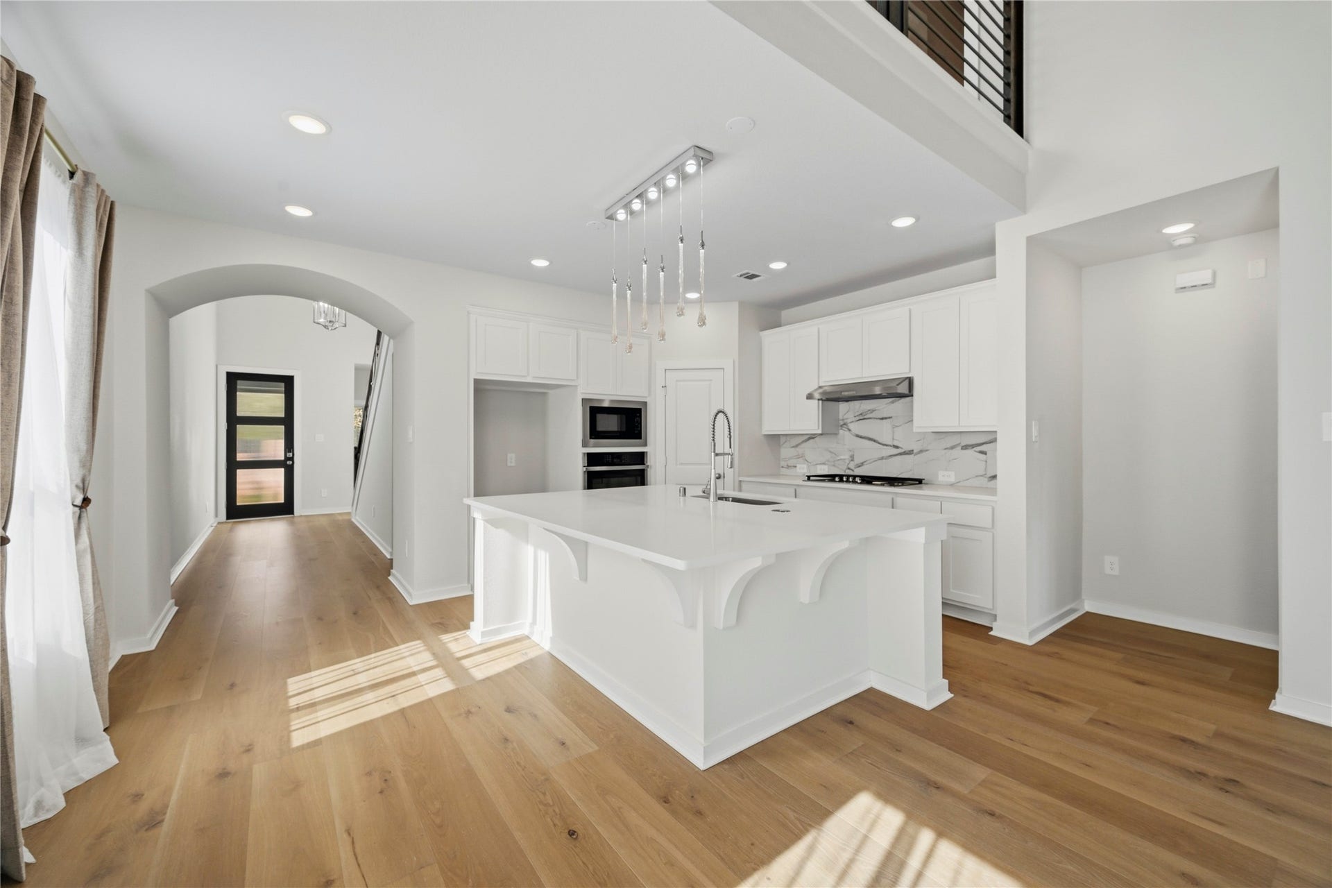 29821 Ellwood Lane, Fulshear, TX 77441 Walk further into the home and discover the spacious open-concept kitchen.