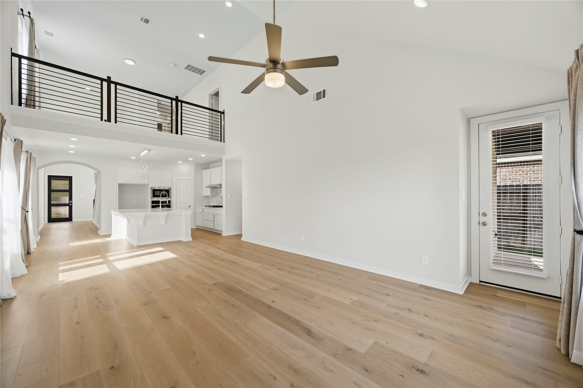 29821 Ellwood Lane, Fulshear, TX 77441 Another view of the expansive family room overlooking the kitchen and second-floor loft.